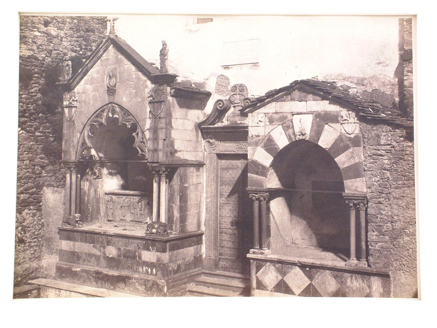 View of sepulchral monuments of the Andreani family attached to church, Corenno Plinio, Italy