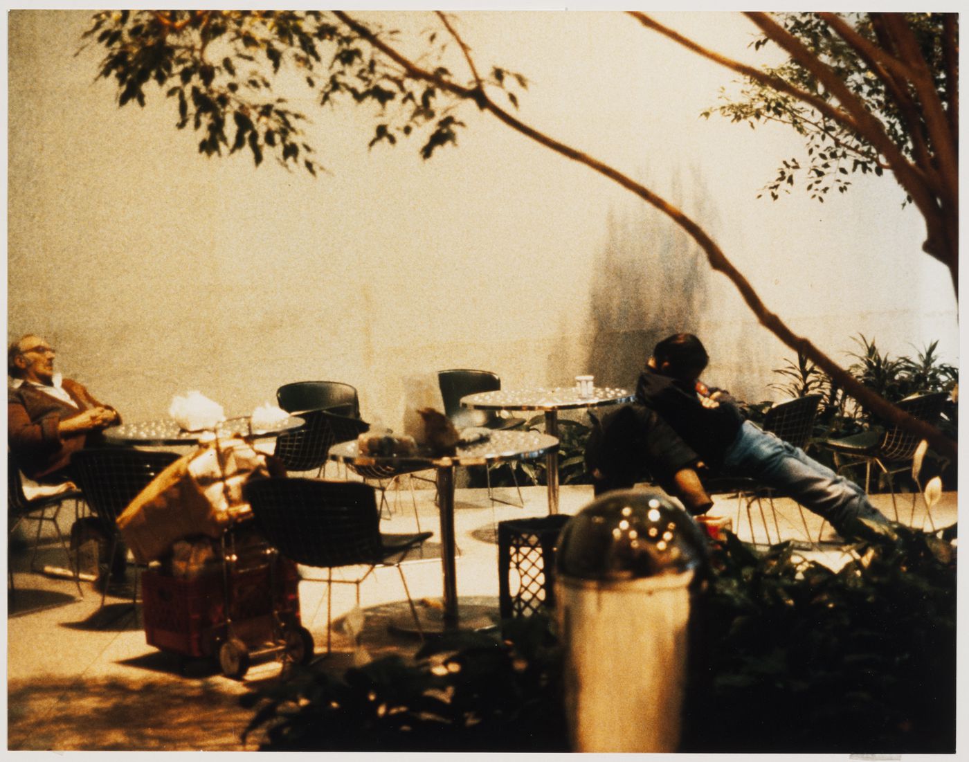 Unhoused people resting in the ChemCourt Atrium, Park Avenue, New York, New York, United States (from the series "Private Public Spaces: The Corporate Atrium Garden")