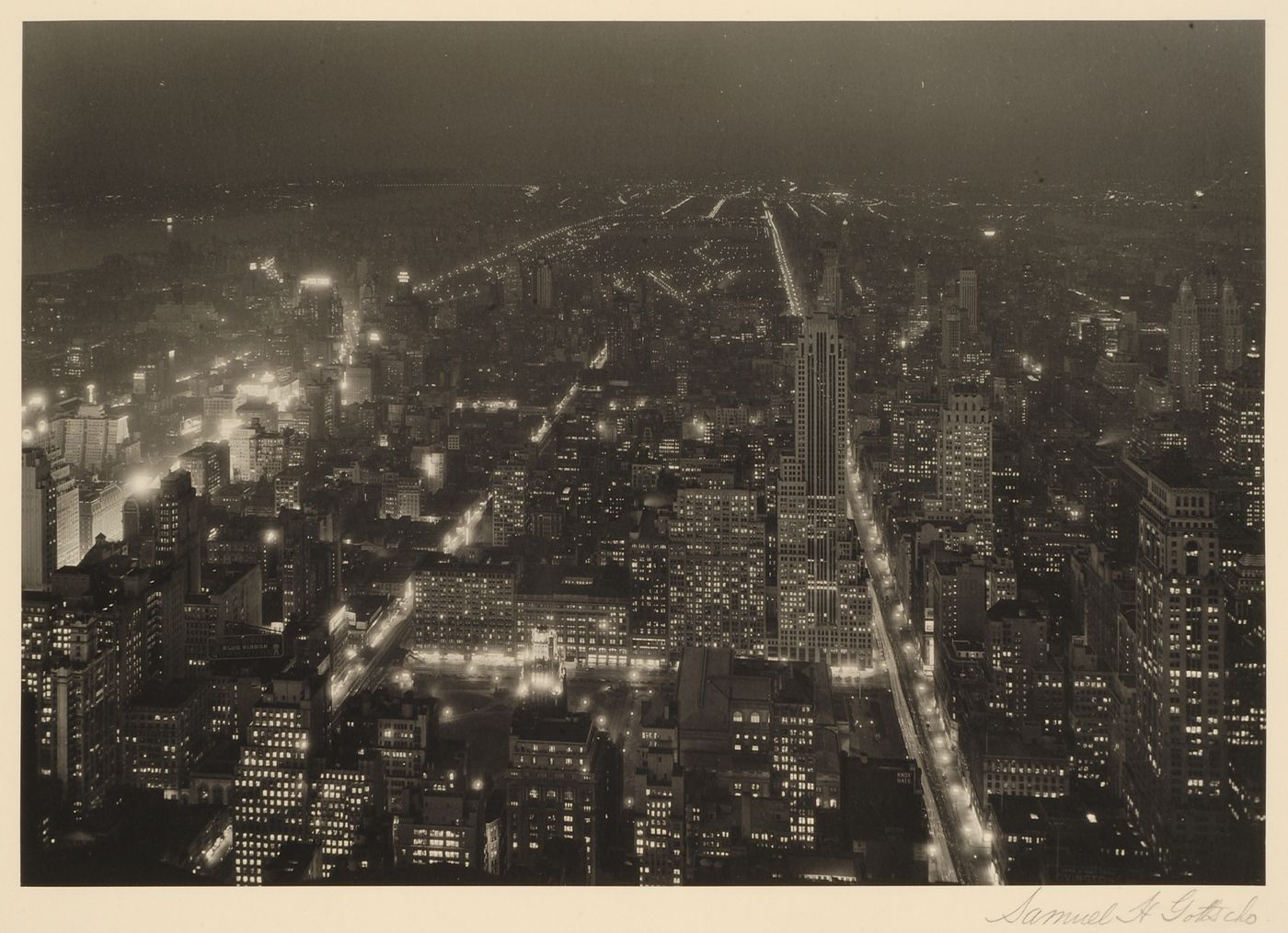 Looking North toward Central Park between 5 and 6th Avenues from Empire State Building at night, New York City, New York