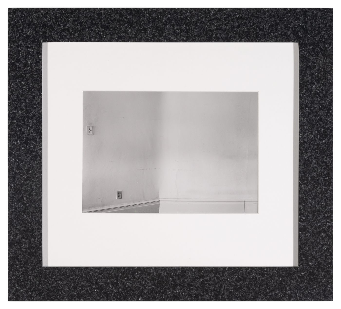 View of a corner in an apartment with double wall outlet and light switch, Ann Arbor, Michigan, United States