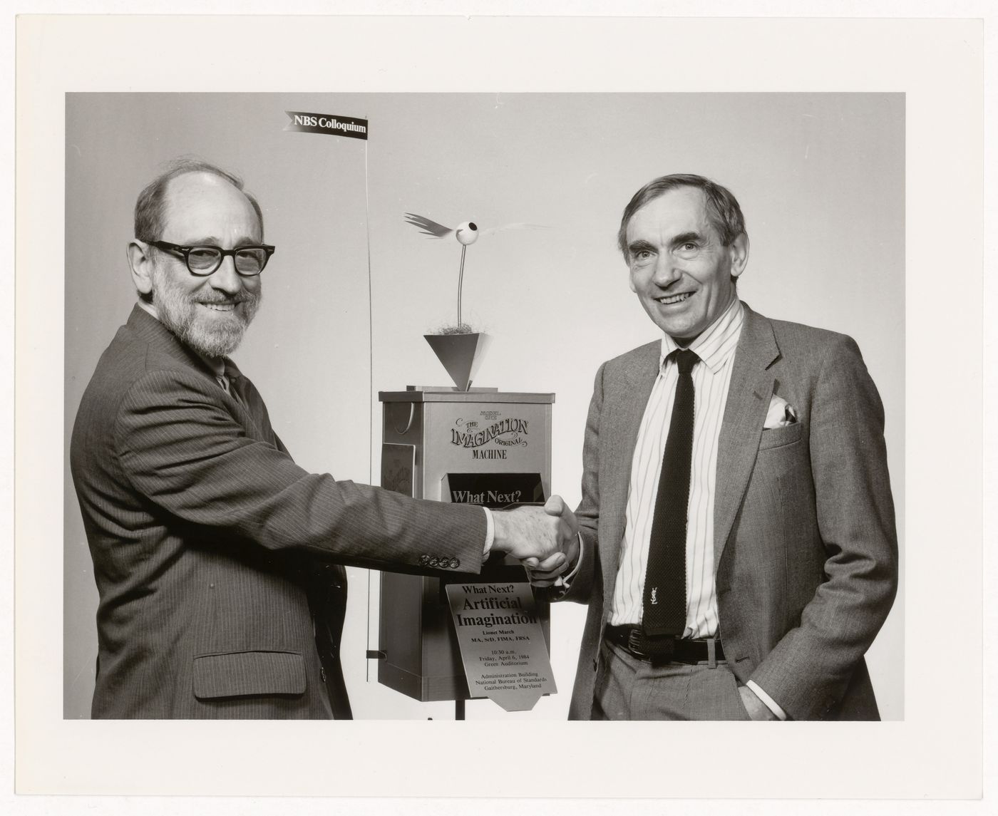 Photograph of Russell A. Kirsch and Lionel March with Imagination Machine for National Bureau of Standards Colloquium