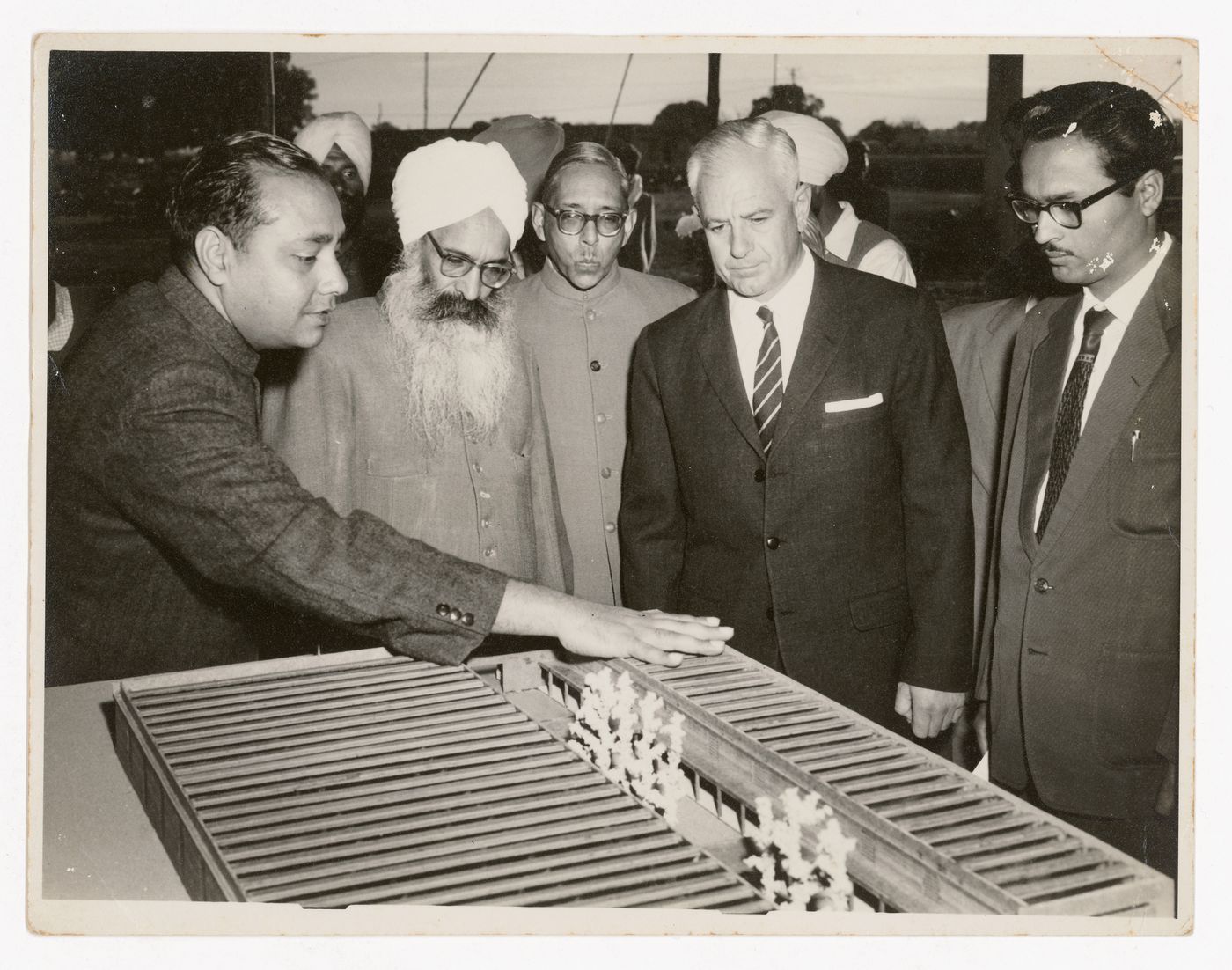 Photograph of Aditya Prakash presenting the model for the Indo-Swiss Training Centre to Chief Minister Partap Singh Kairon, along with Swiss experts
