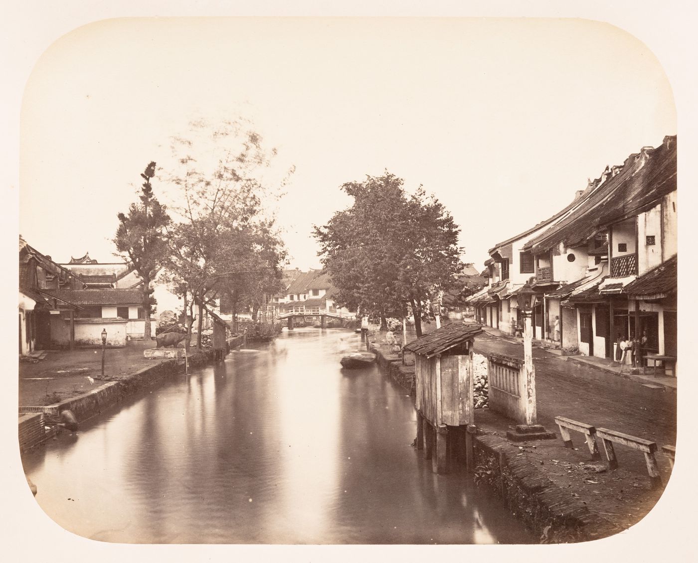 View of buildings, the Krukut River and Jalan Toko Tiga street in Glodok, Batavia (now Jakarta), Dutch East Indies (now Indonesia)