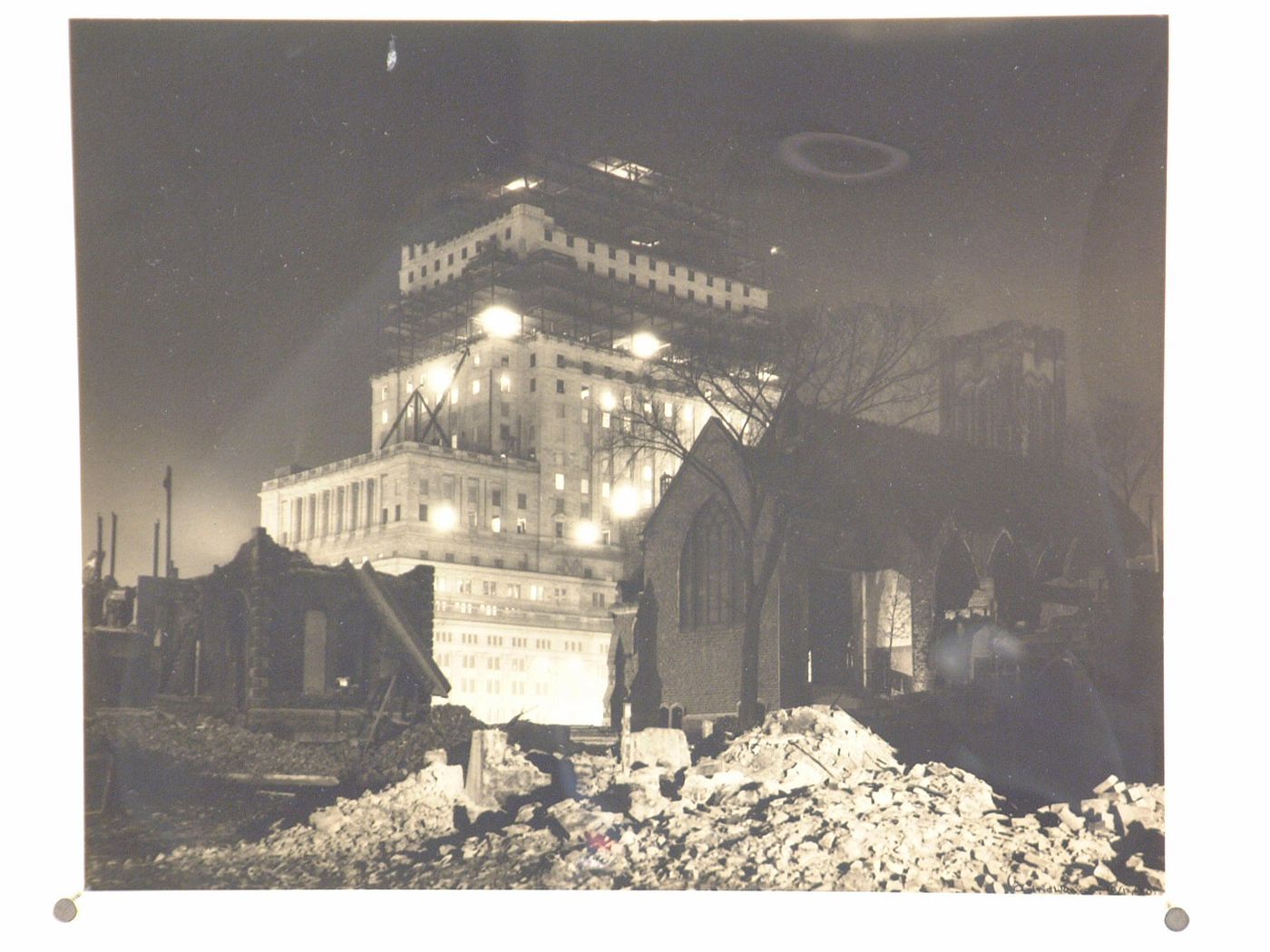 View of the Sun Life Building under construction with St. George's Church in the foreground, Montréal, Québec