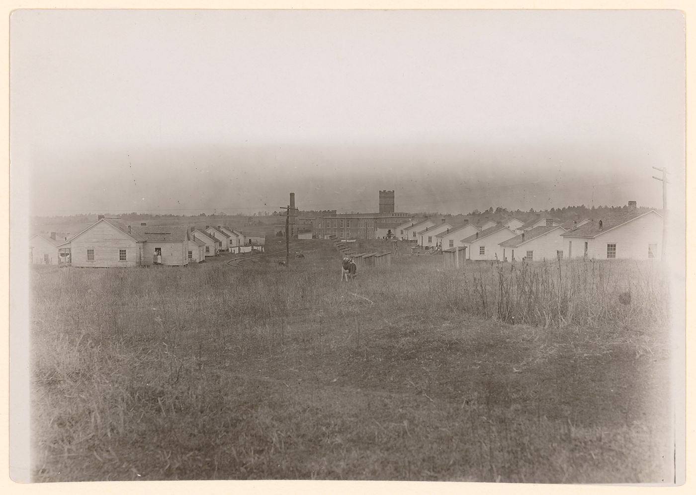 View of settlement with houses and outhouses in front of Wylie Mill, Chester, South Carolina, United States