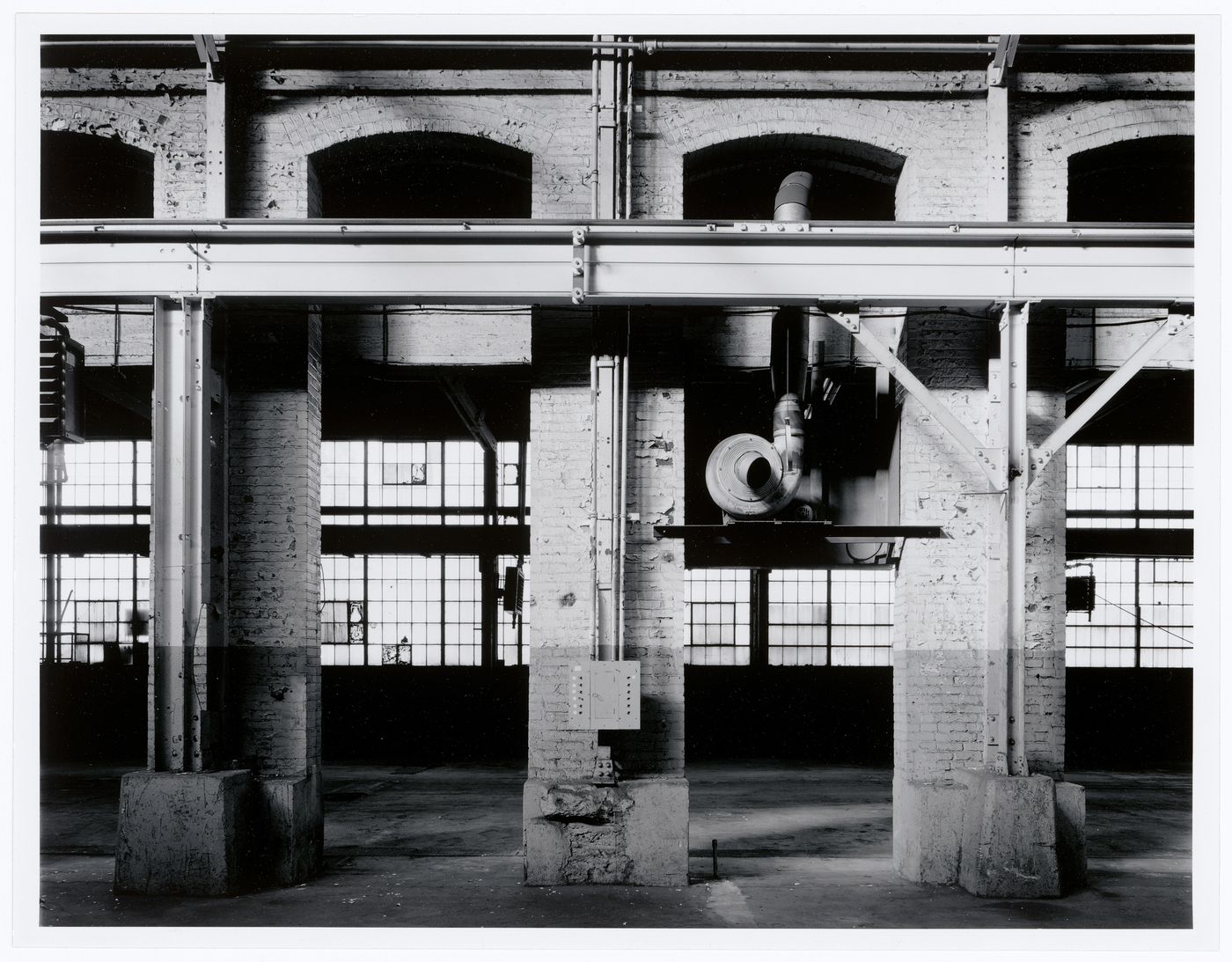 Interior view of the main floor of the Canadian Switch & Spring Company Building showing an overhead crane, Montréal, Québec