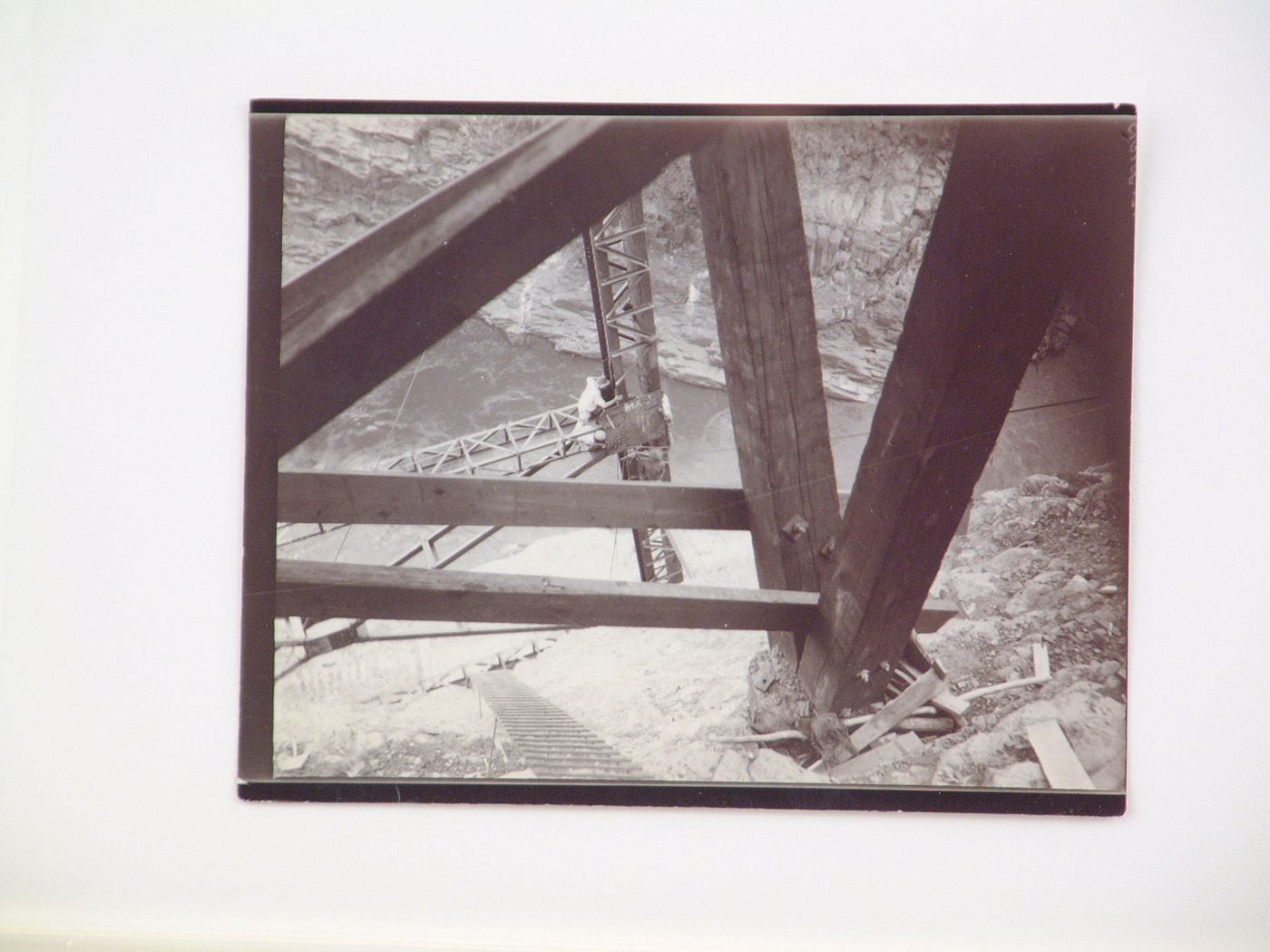 View of people working on steel beams during the construction of Victoria Falls Bridge, Zambezi River, crossing the border between Victoria Falls, Zimbabwe and Livingstone, Zambia