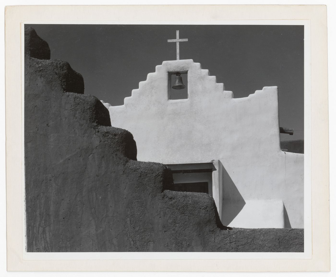 Partial view of  façade of the Church of San Lorenzo, showing church bell, Picuris, New Mexico, United States