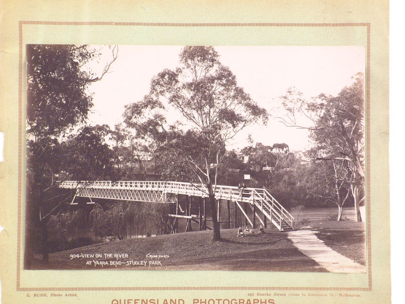 View of Studley Park showing a footbridge over the Yarra River, Melbourne, Australia