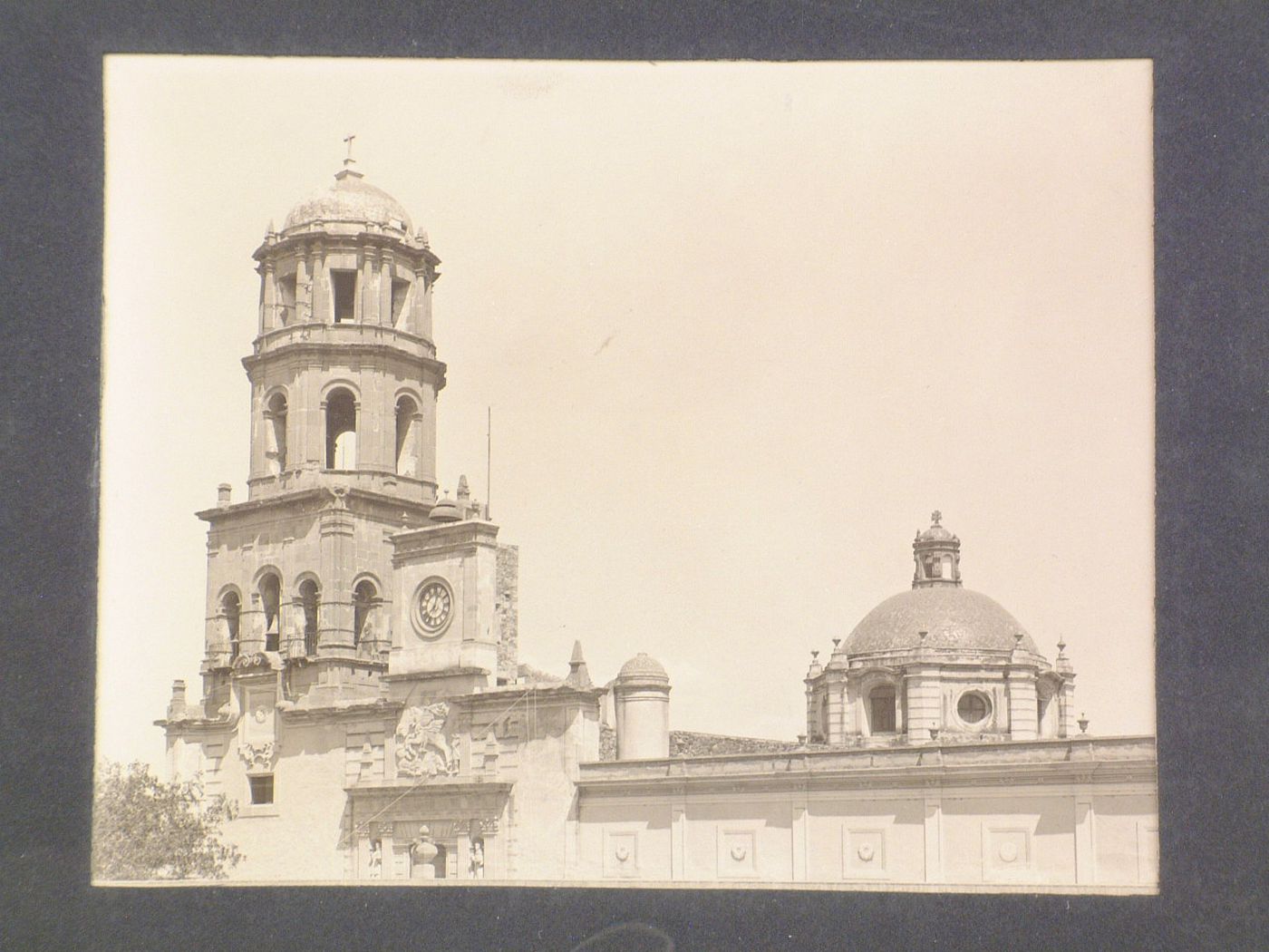 View of the tower, of part of a façade and of the dome of the Church of San Agustín, Celaya, Mexico