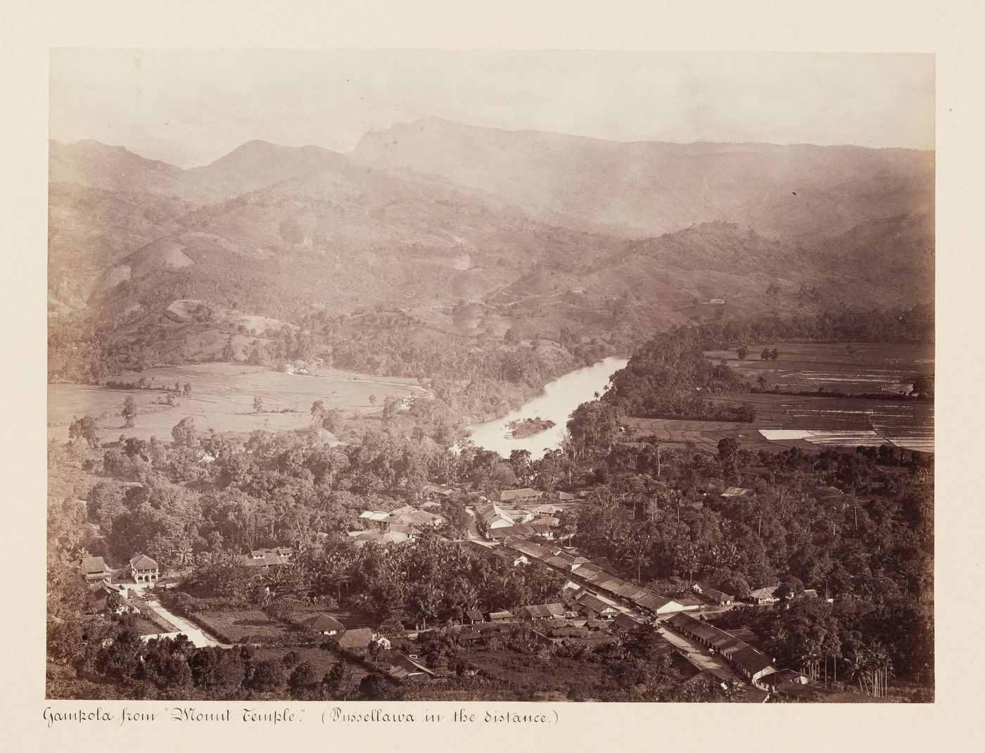 Partial view of Gampola from Mount Temple showing a river with mountains in the background, Ceylon (now Sri Lanka)