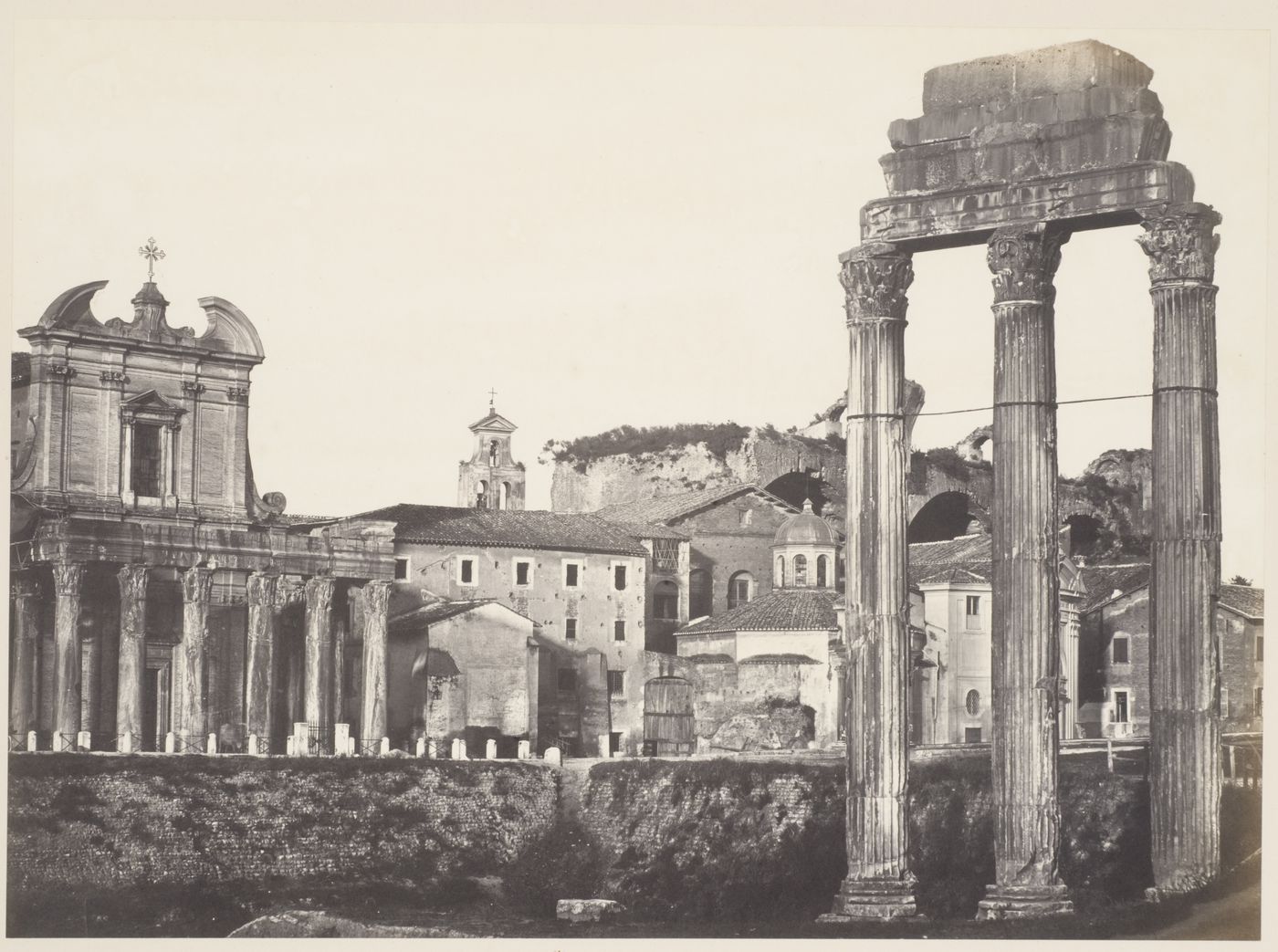View of the Roman Forum with the Temple of Antoninus and Faustina, the Temple of the Dioscuri in the Circus Flaminius, and in the distance the Basilica of Constantine, Rome, Italy