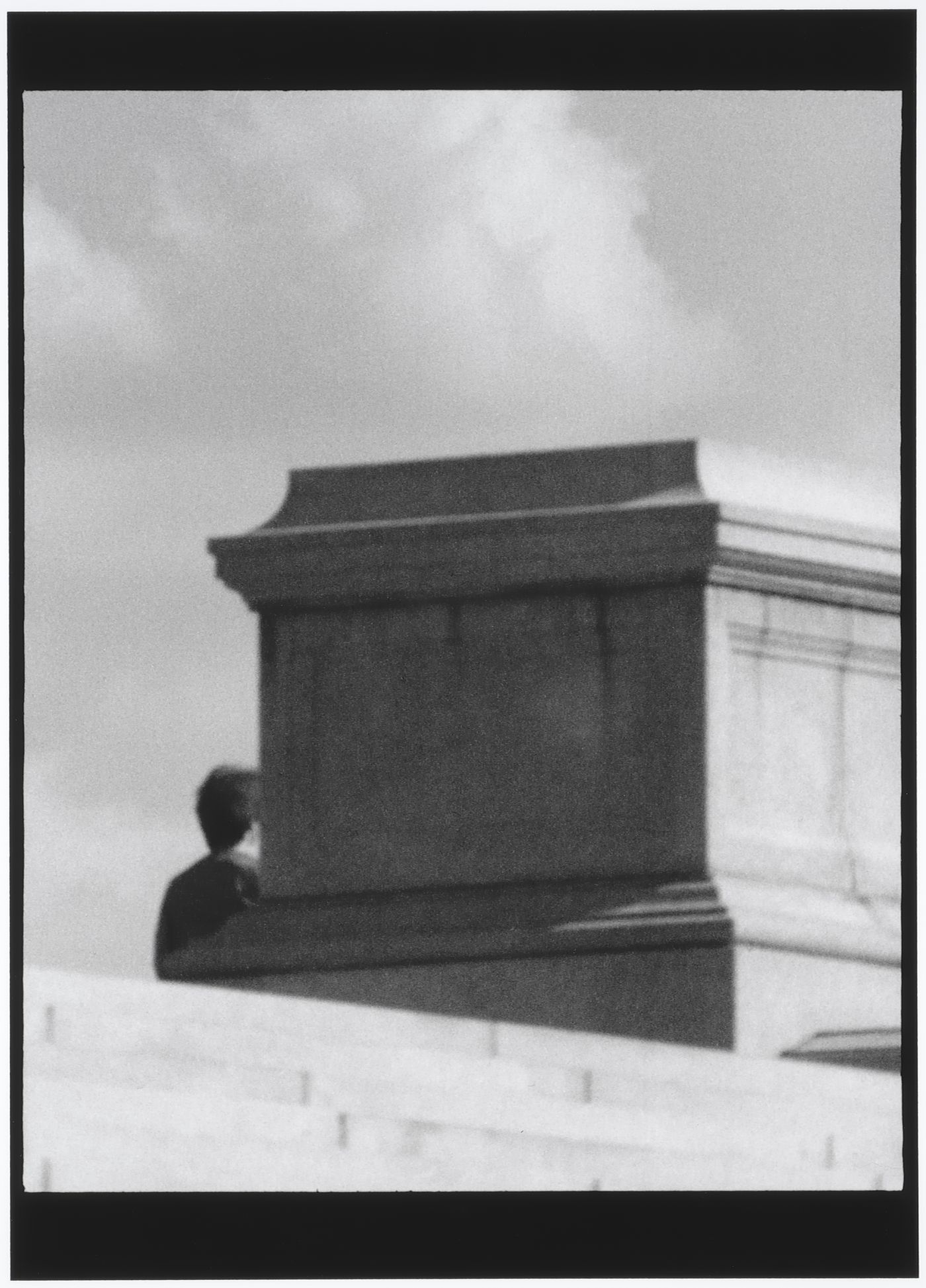 Partial view of the Arlington Memorial Bridge showing stonework with a man in the background, Washington D.C., United States, from the series "Empire"