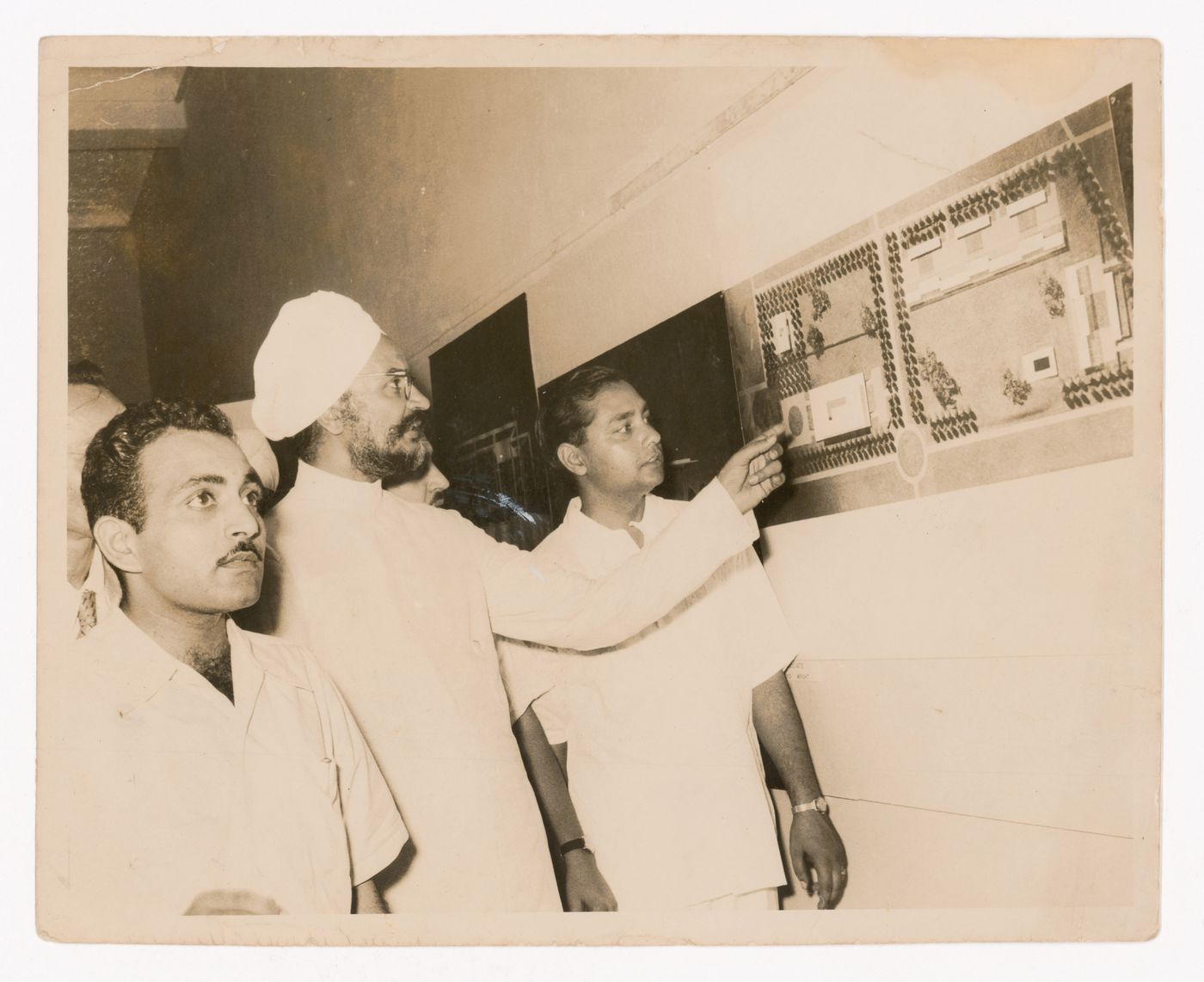 Photograph of Aditya Prakash showing material at an unidentified exhibition
