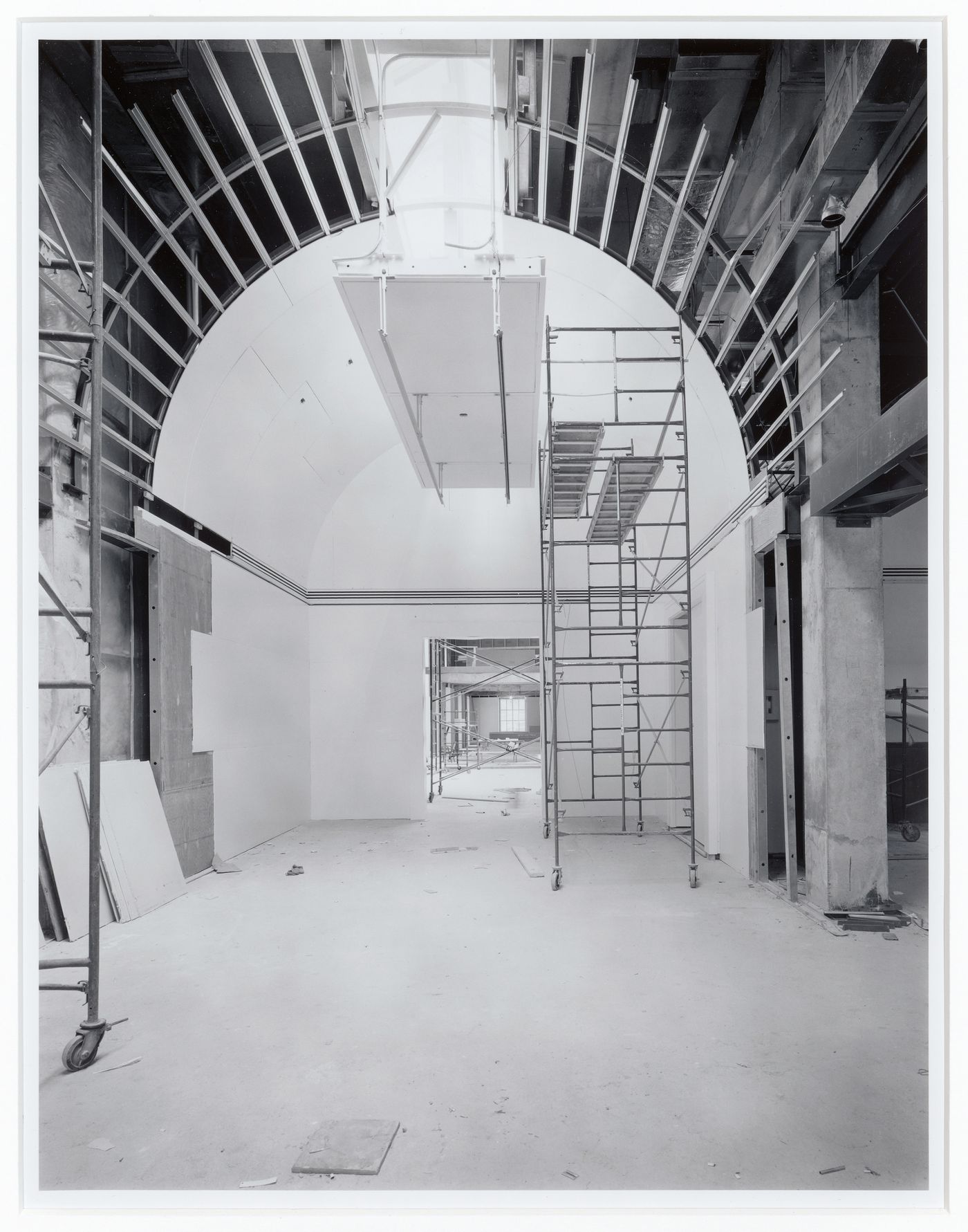 Interior view of an exhibition gallery showing the vaulted ceiling and scaffolds, Canadian Centre for Architecture under construction, Montréal, Québec