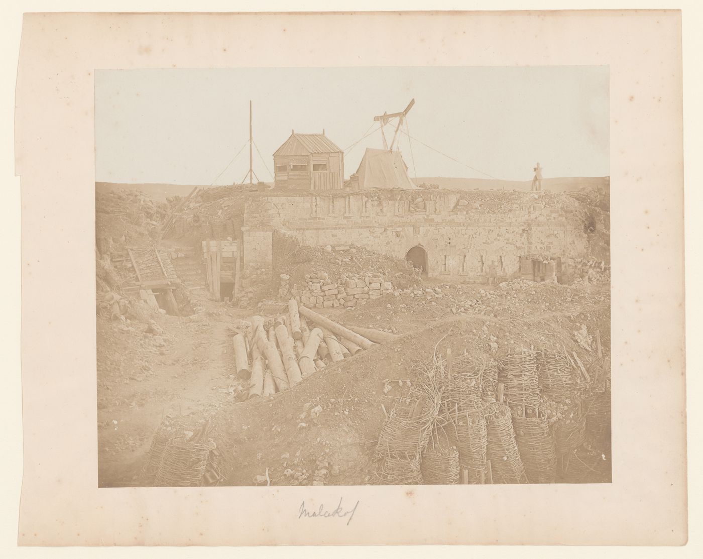 View of military stone, wooden and earth constructed breastworks, figure atop stone wall, Malakhov, Crimea, Ukraine