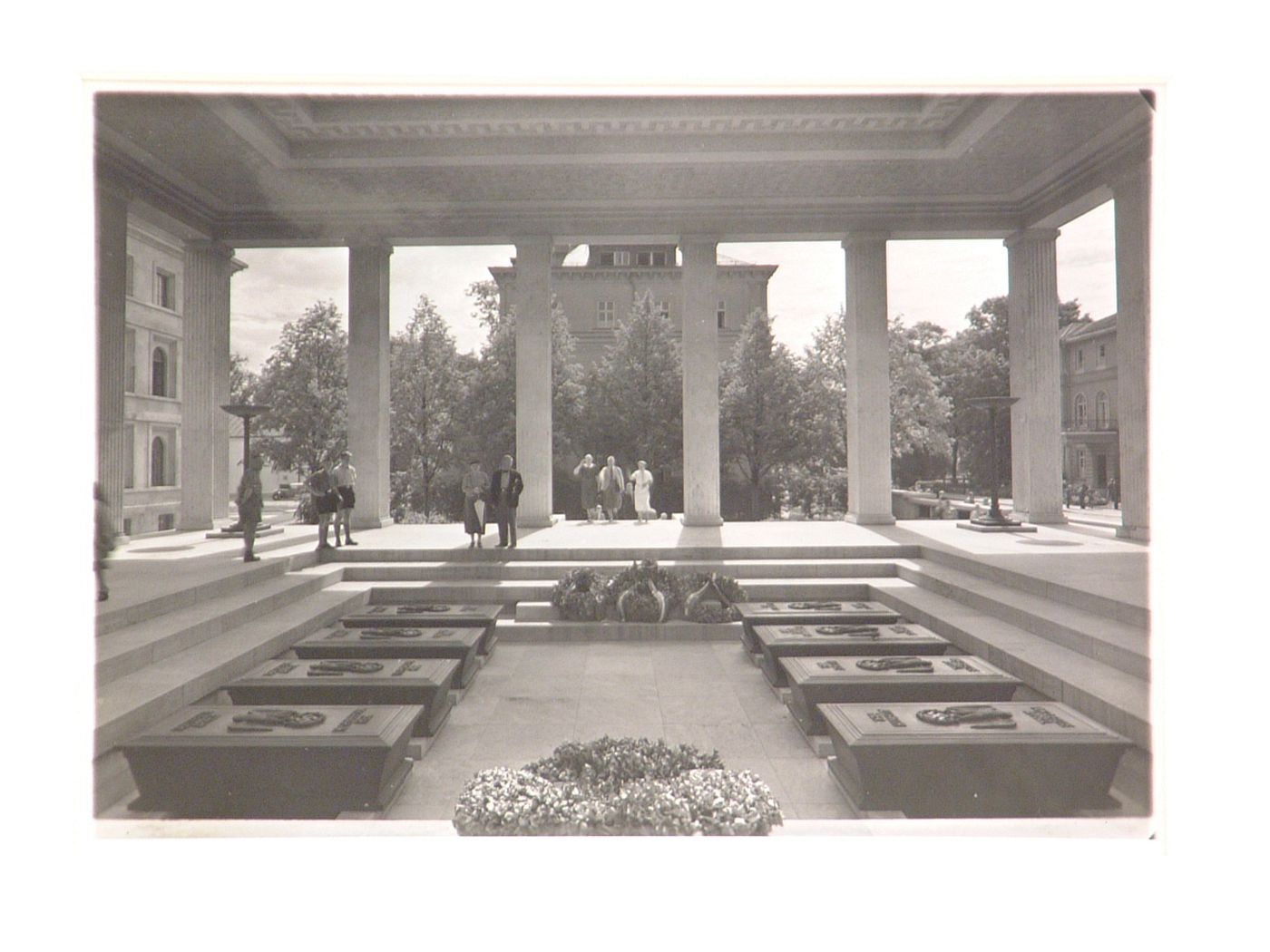 Interior of open-roofed neoclassical memorial structure, with sarcophagi in sunken court, Munich, Germany