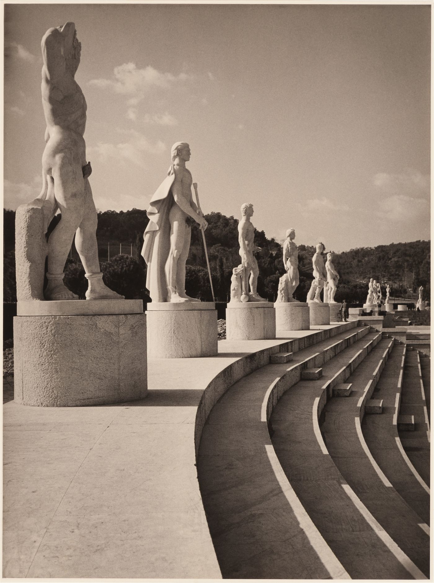 Detail of colossal statues of athletes in the Stadium of the Marbles (Stadio dei Marmi), Mussolini's forum, Rome, Italy