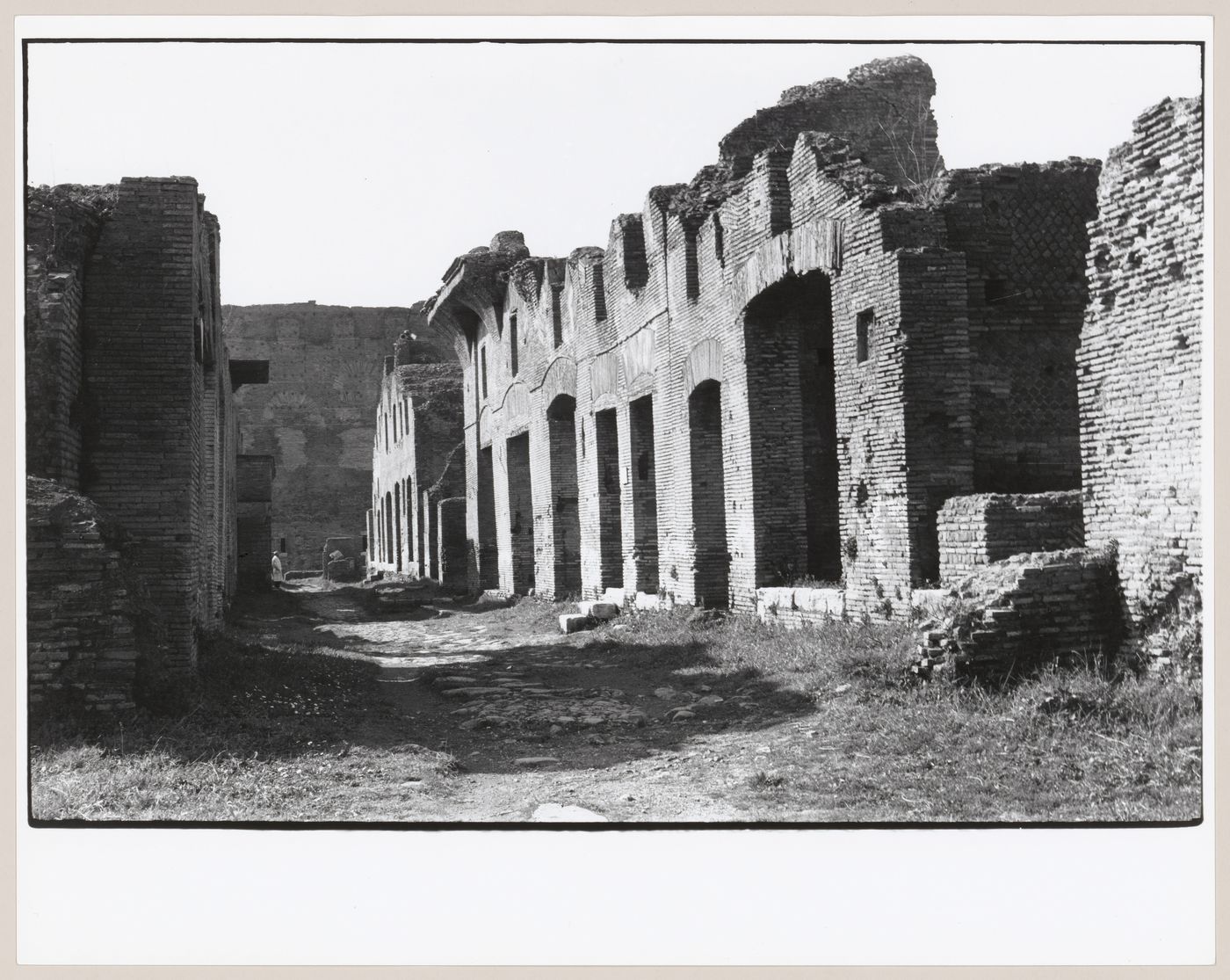 View of the ruins of Ostia showing a street and commercial buildings [?], Italy