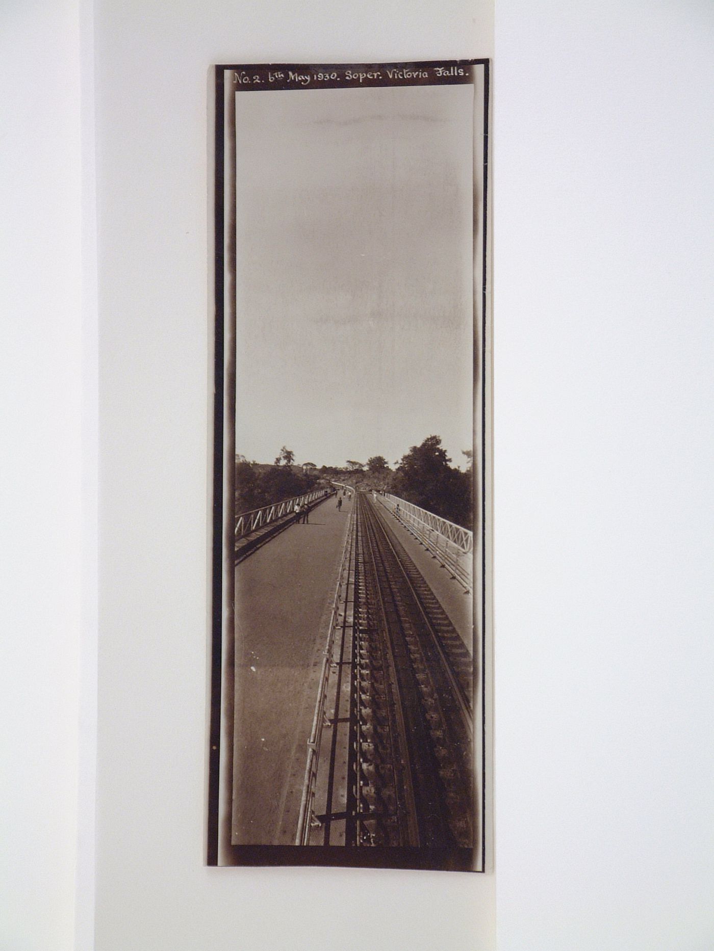 Vertical panoramic view of railway, road and footpath on Victoria Falls Bridge, Zambezi River, crossing the border between Victoria Falls, Zimbabwe and Livingstone, Zambia