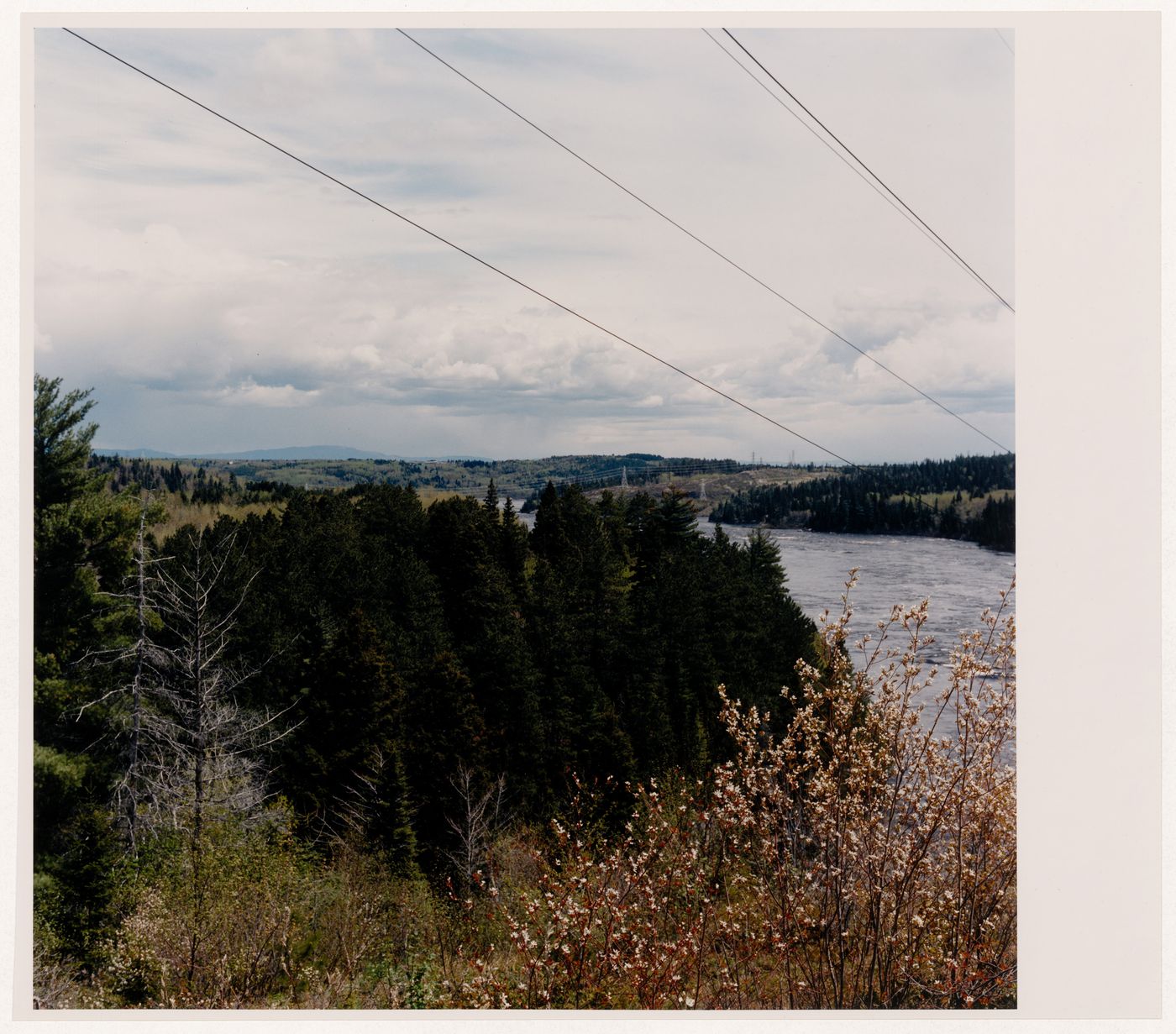 Section 4 of 4 of Panorama of the Shipshaw hydro-electric site, looking northeast, showing pylon, dam, power station, and Saguenay River