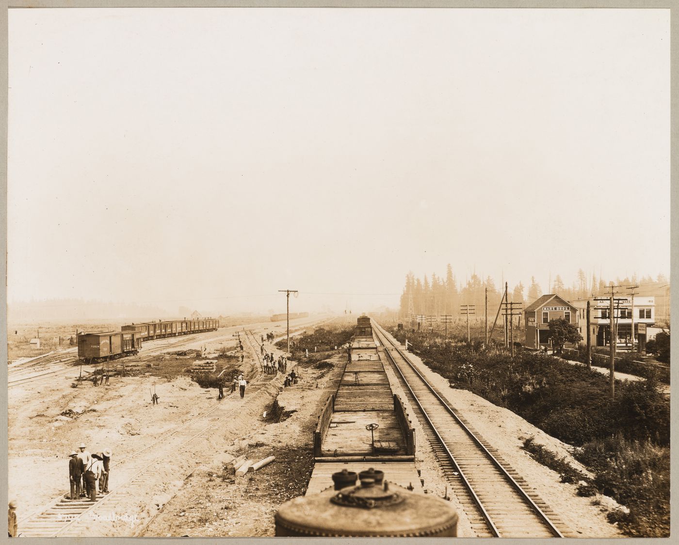View of the Canadian Pacific Railroad Company freight yards under construction showing workers and trains, Coquitlam (now Port Coquitlam), British Columbia