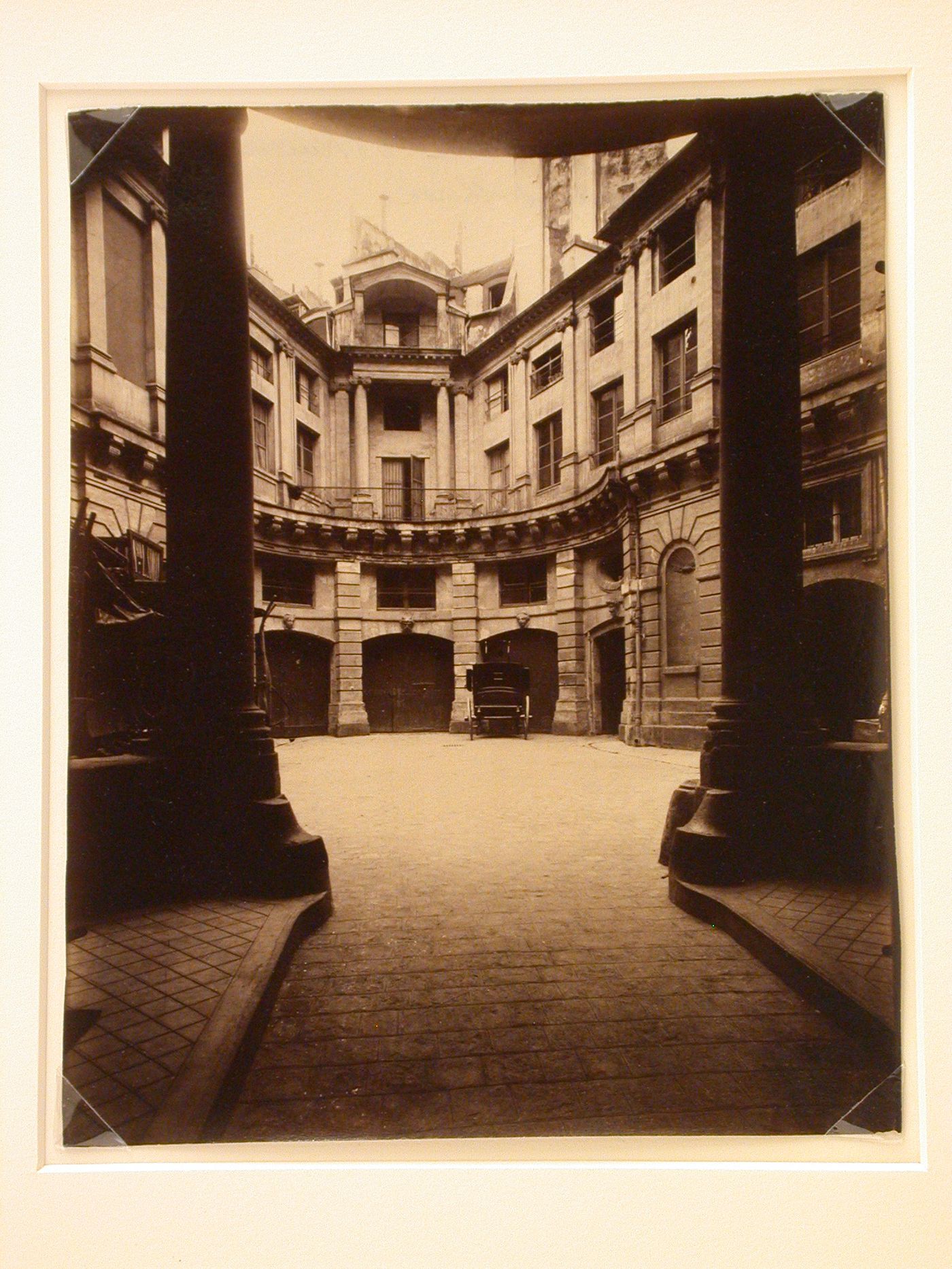 Hôtel de Beauvais: Looking into courtyard from street entrance, showing garage entrances, Paris, France