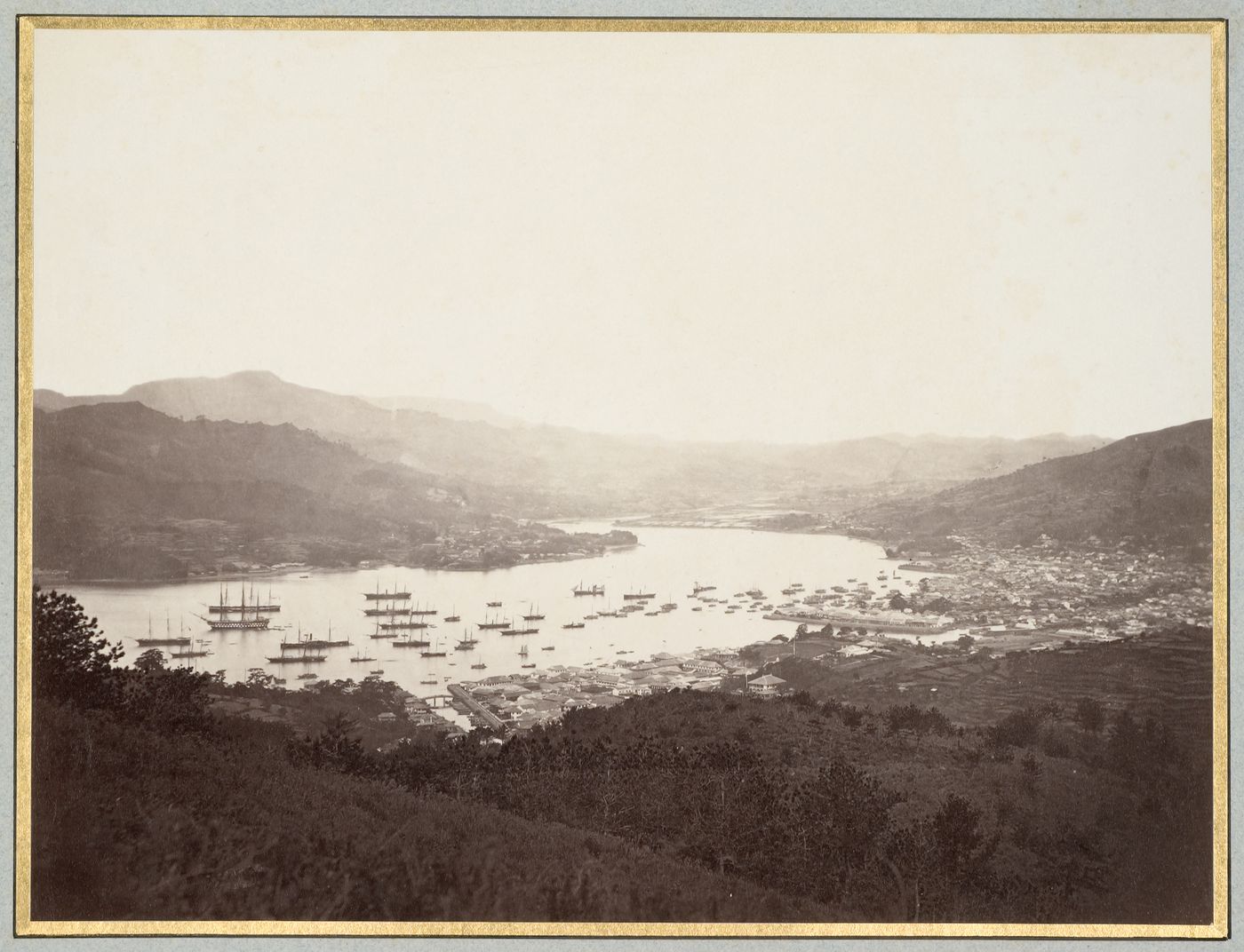 Panoramic view of the harbour and city, showing the foreign settlements of Oura-machi and Deshima, Nagasaki, Japan