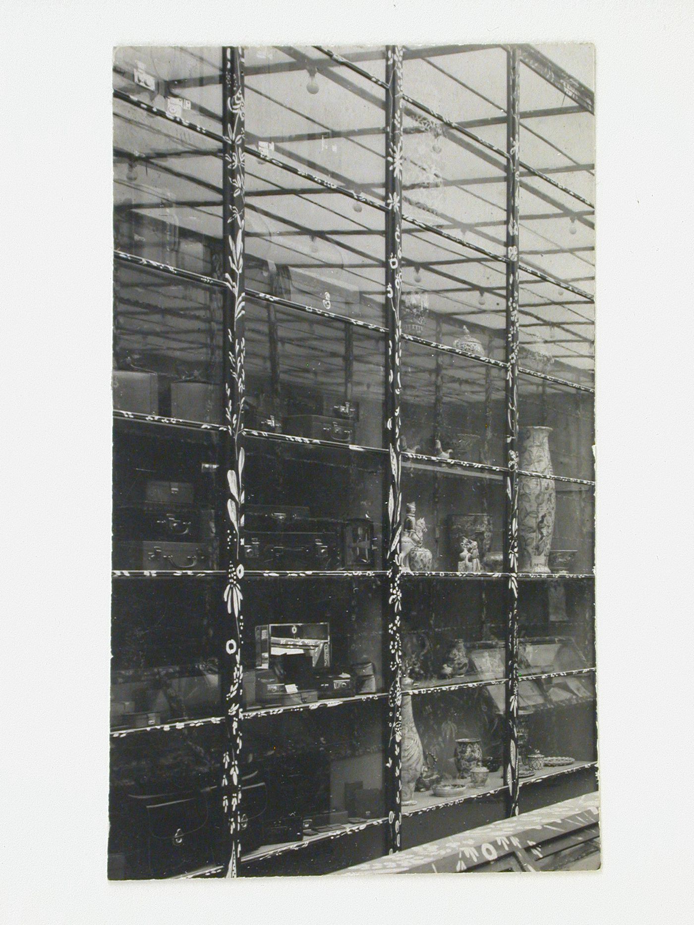 Interior view of a wall of exhibit cases in the Main Exhibition Hall of the Austrian Pavilion, International Exhibition of Modern Decorative and Industrial Arts [Exposition internationale des arts décoratifs et industriels modernes], Paris, France