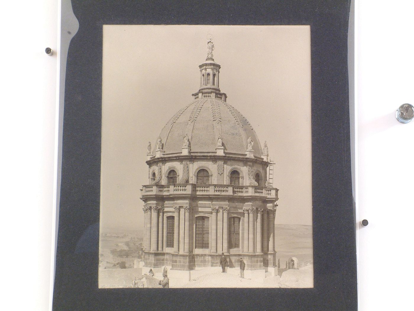 View of the dome of the Church of La Concepción with people on the roofs and hills in the background, San Miguel de Allende, Mexico