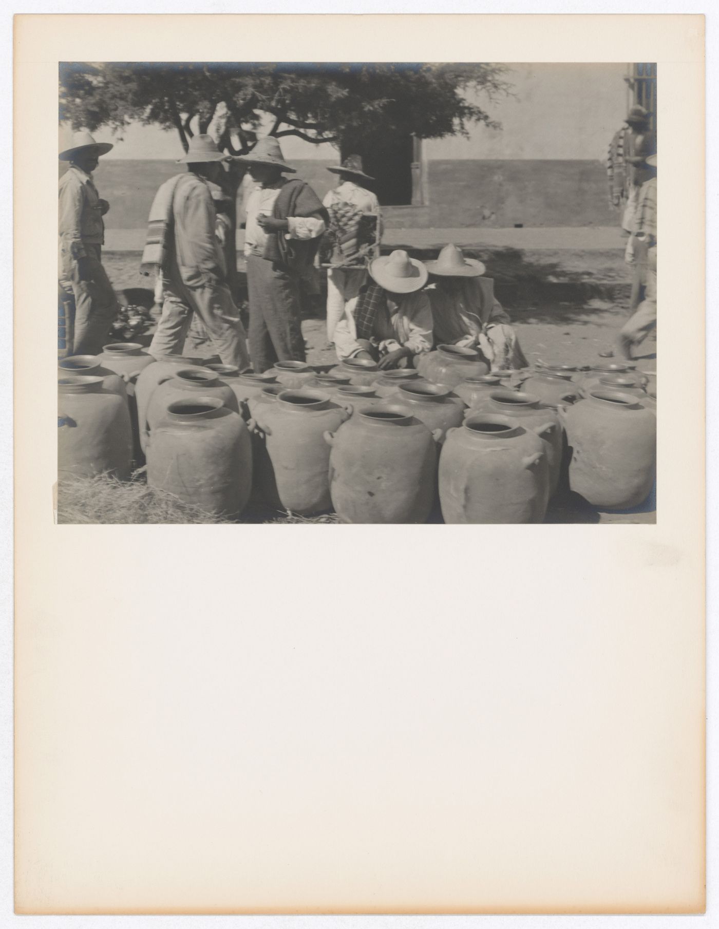 View of a market showing water jugs and people, Mexico