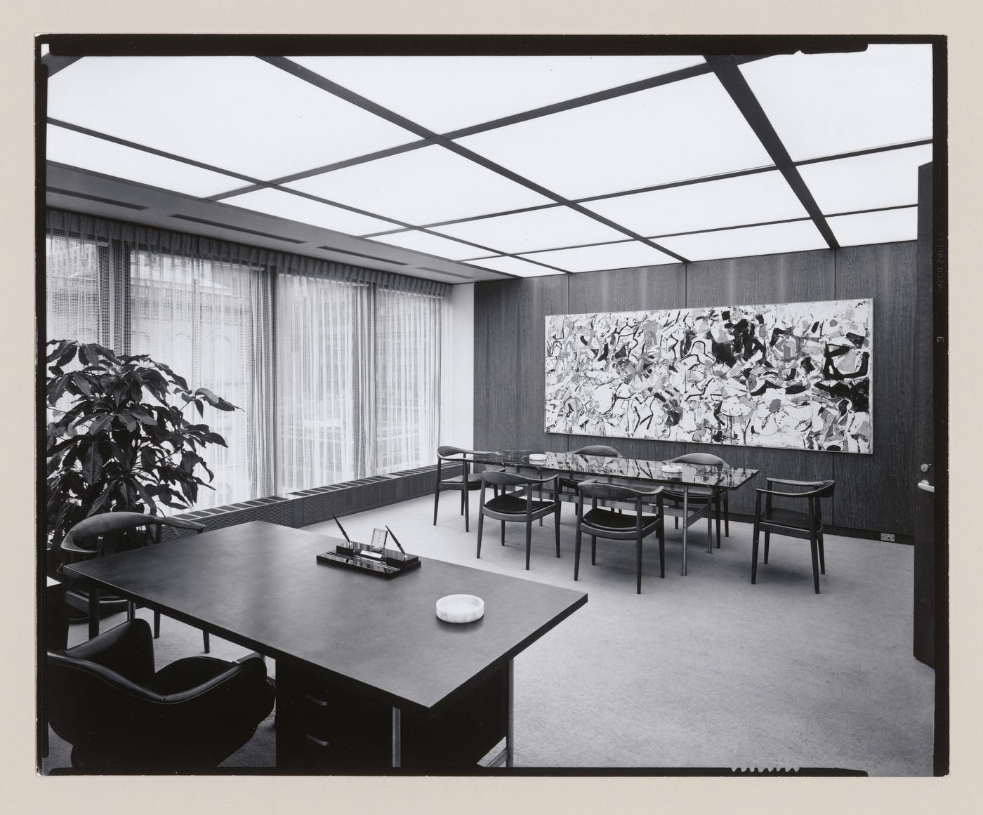 Interior view of the fifth floor executive office and conference room in the Seagram Building showing furniture and the recessed light fixtures designed by Richard Kelly, New York City