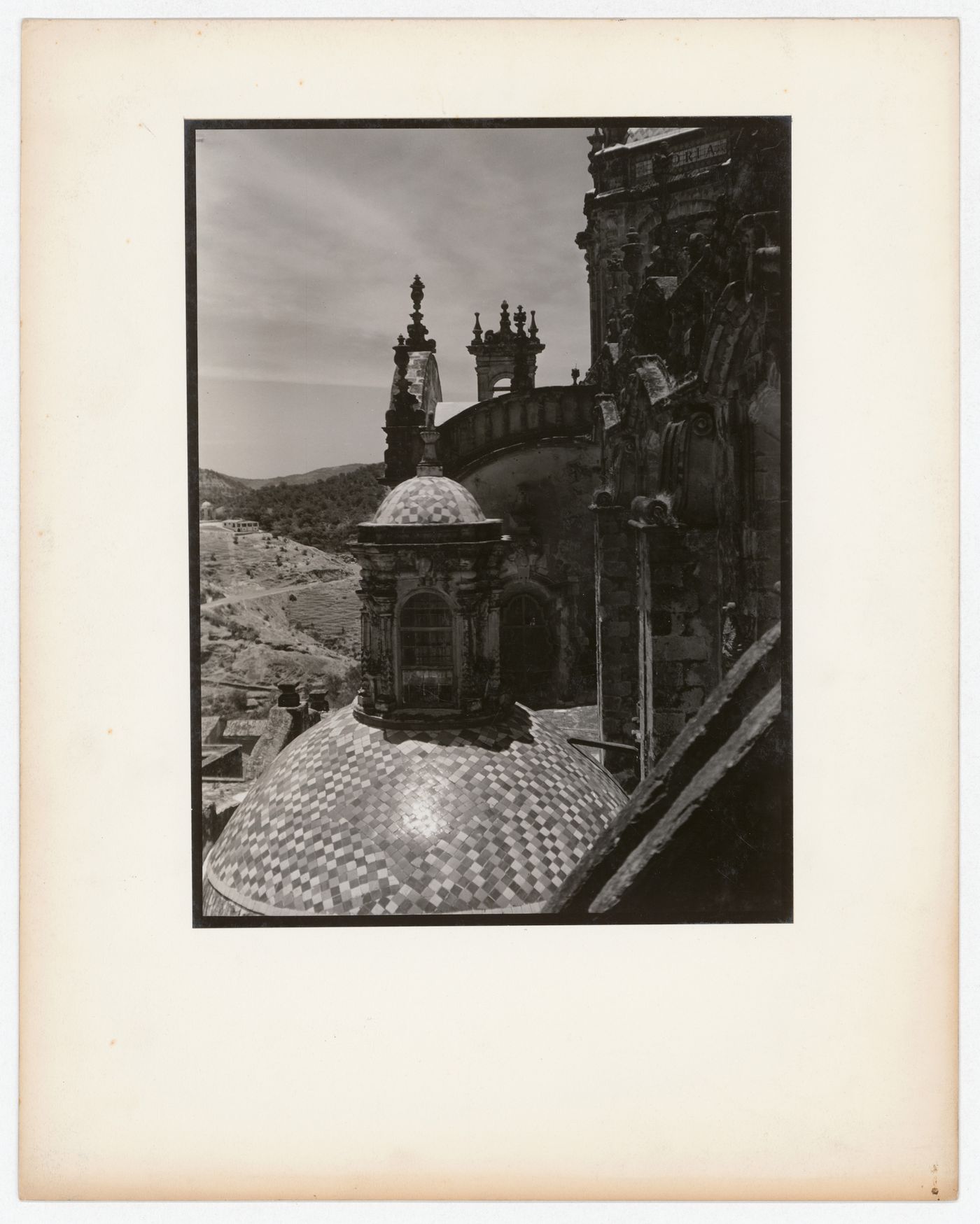 View of the dome of a chapel of Santa Prisca with hills in the background, Taxco de Alarcón, Mexico
