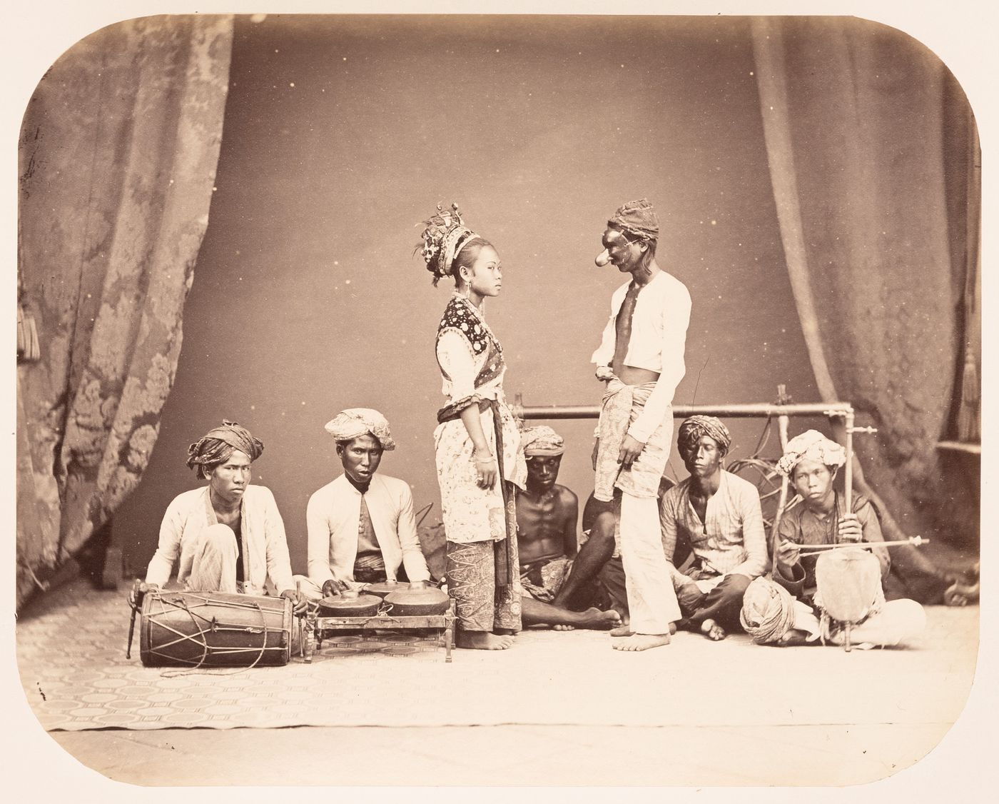 Group portrait of musicians and actors, Dutch East Indies (now Indonesia)