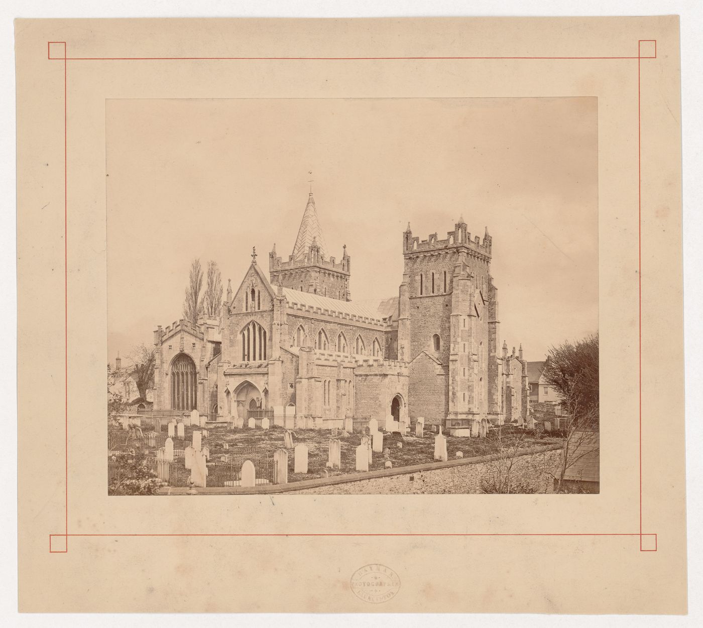 View of a cemetery and church taken from outside the churchyard, England