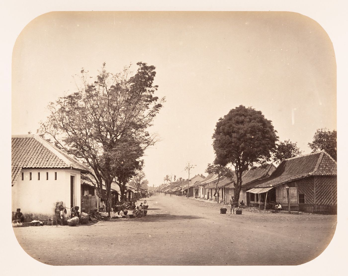 View of the Pasar Baru market showing stores, a street and people, Bandong (now Bandung), Dutch East Indies (now Indonesia)
