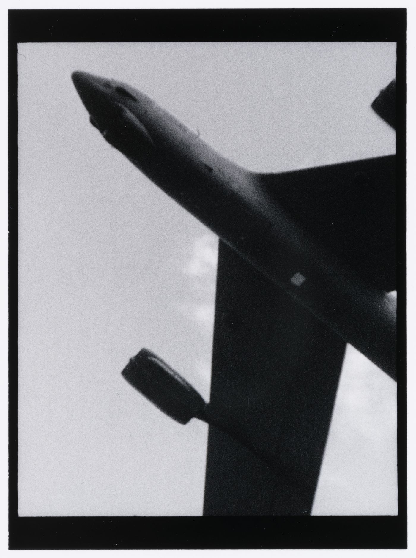 View of a Boeing B52 strategic bomber passing overhead, Washington, D.C., United States, from the series "Empire"