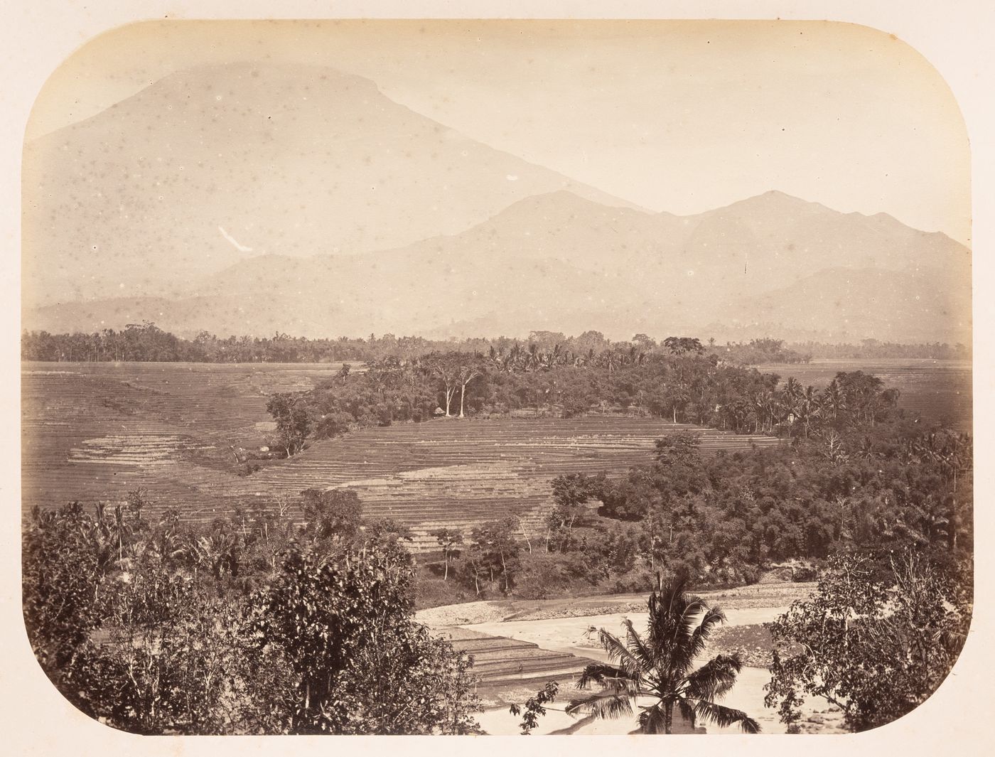 View of the Progo River valley showing a volcano, near Magelang, Dutch East Indies (now Indonesia)