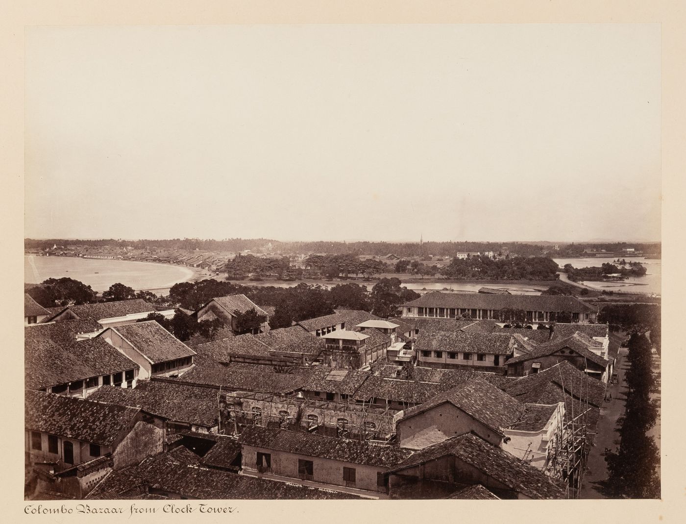 View of Colombo Bazaar from the clock tower and lighthouse with the harbour on the left and Beira Lake on the right, Colombo, Ceylon (now Sri Lanka)