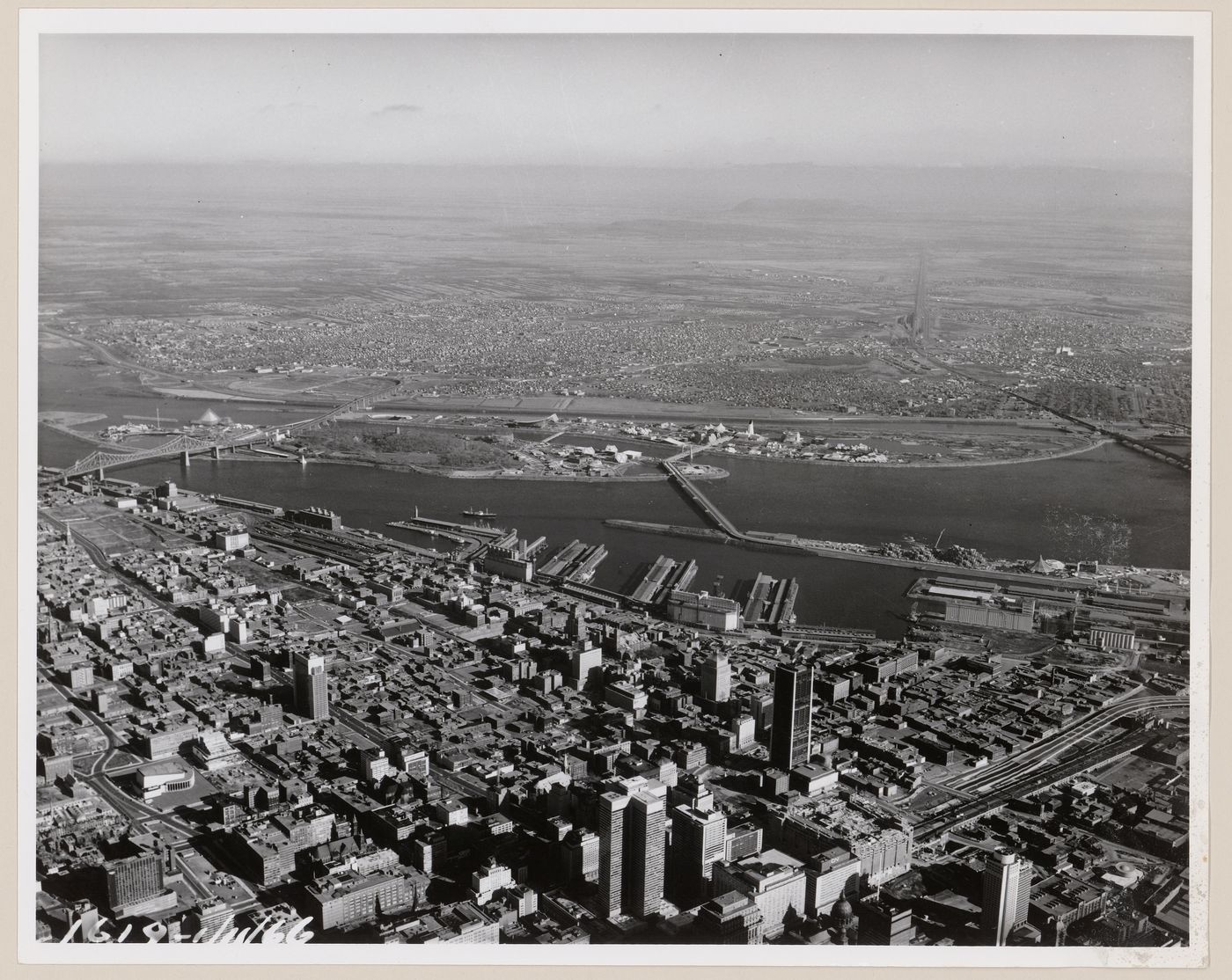 Aerial view of the exhibition sites with Montréal in foreground and the ...