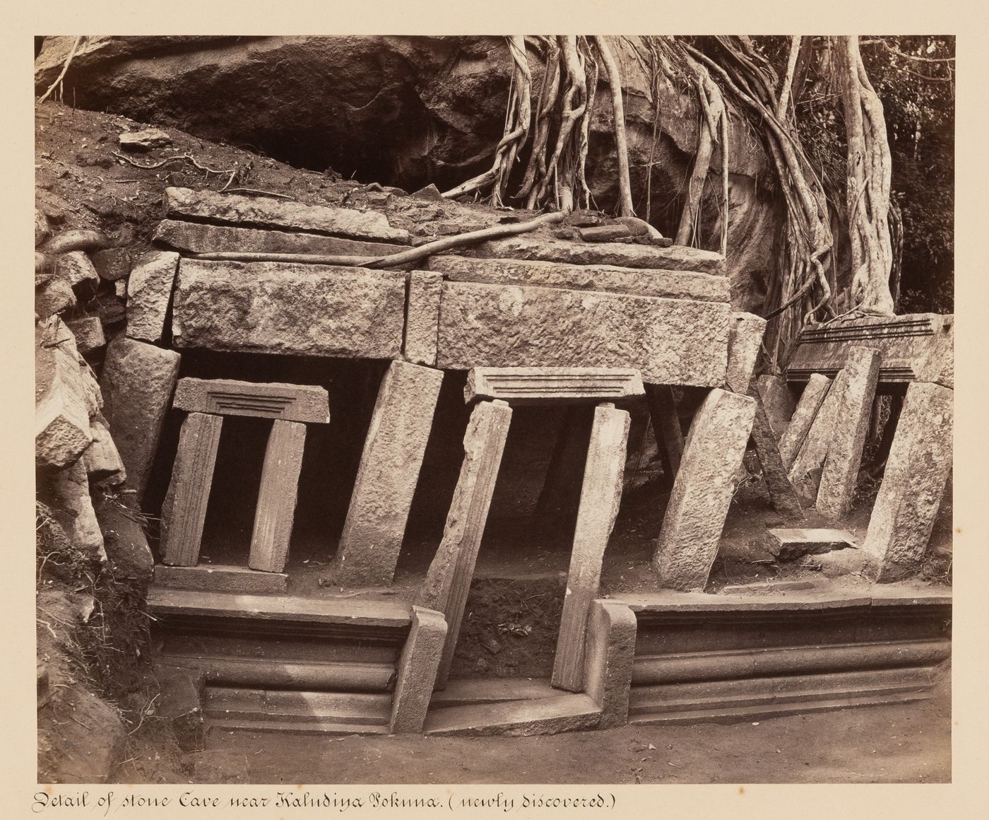 View of stone-walled entrance (now renovated) to cave near the Kaludiya Pokuna, Mihintale, Ceylon (now Sri Lanka)