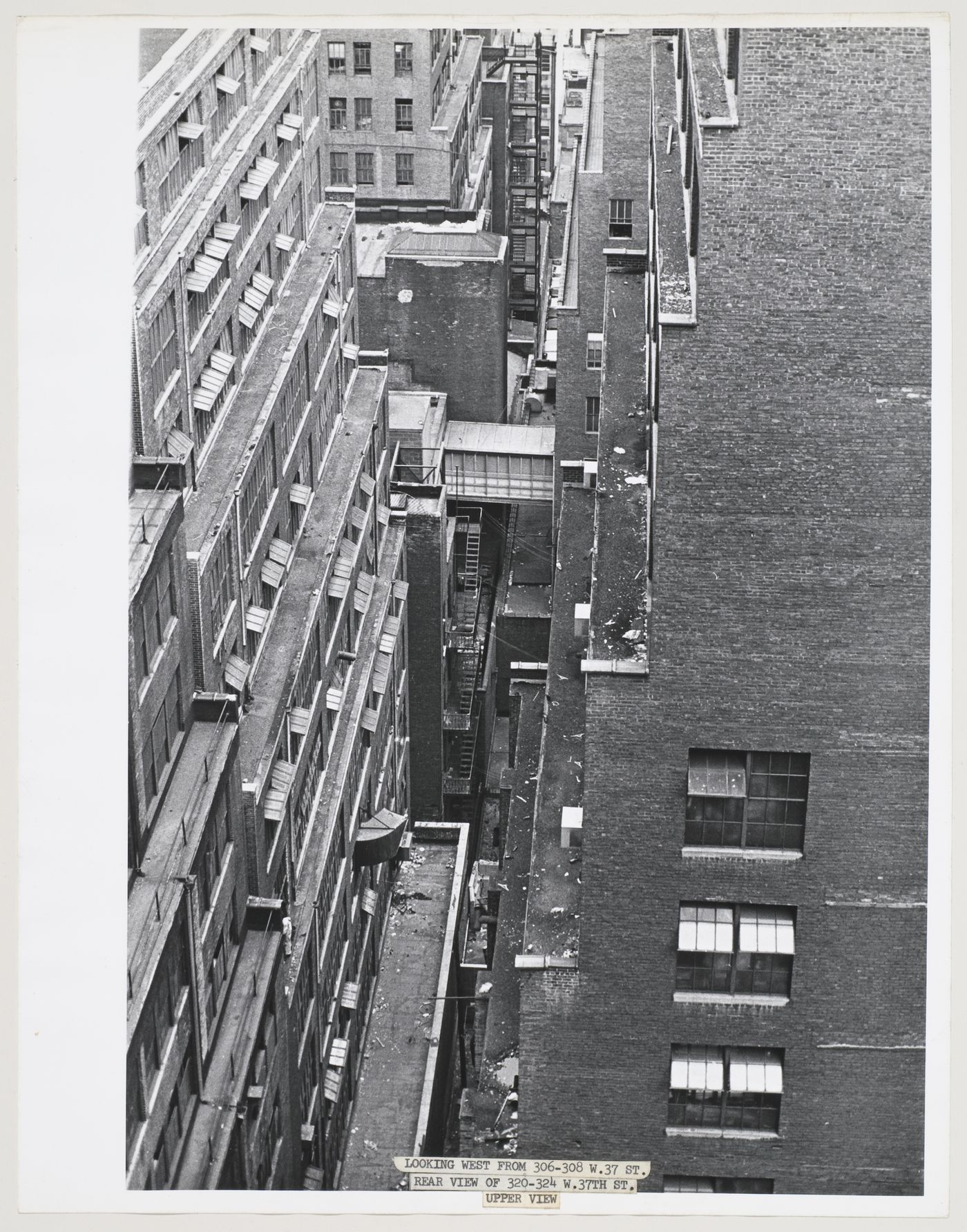 Aerial view of the backs of buildings showing rooftops and the space between buildings, West 37th Street, Manhattan, New York City, New York