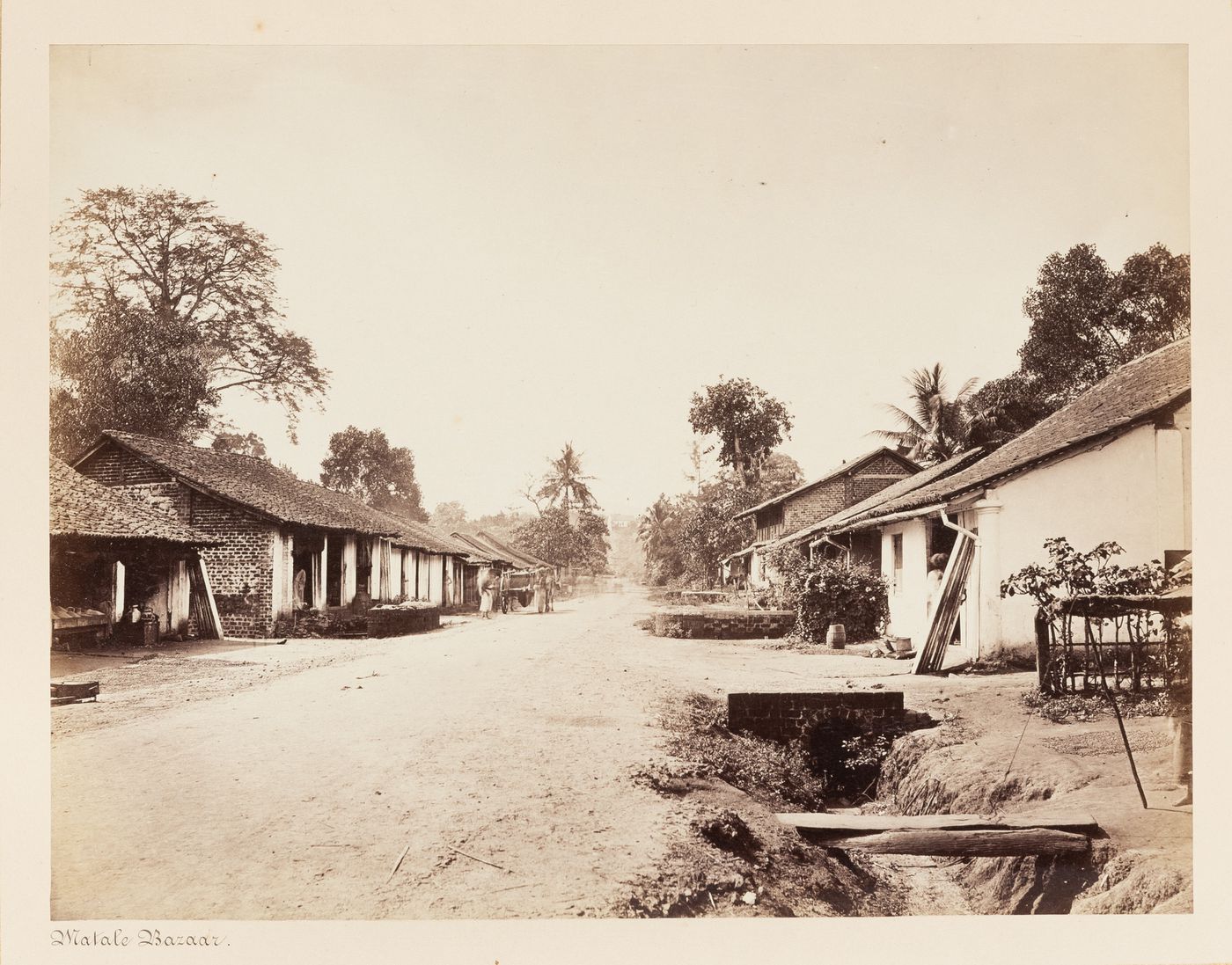 View of a road and houses, Matale Bazaar, Matale, Ceylon (now Sri Lanka)