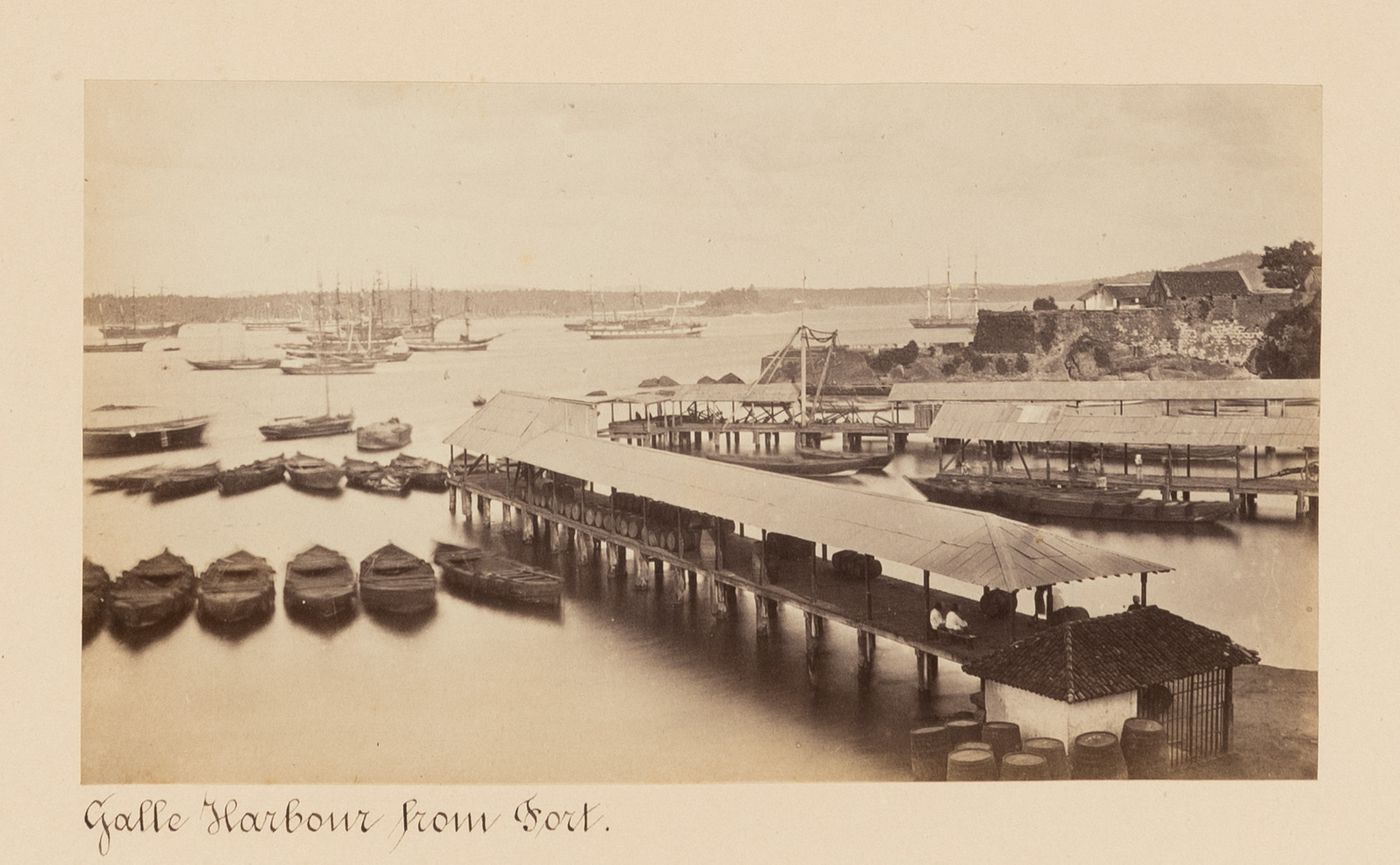 View of the harbour showing piers with ships in the background, Point de Galle (now Galle), Ceylon (now Sri Lanka)