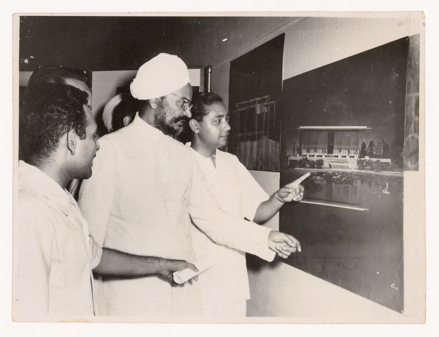 Photograph of Aditya Prakash showing material at an unidentified exhibition